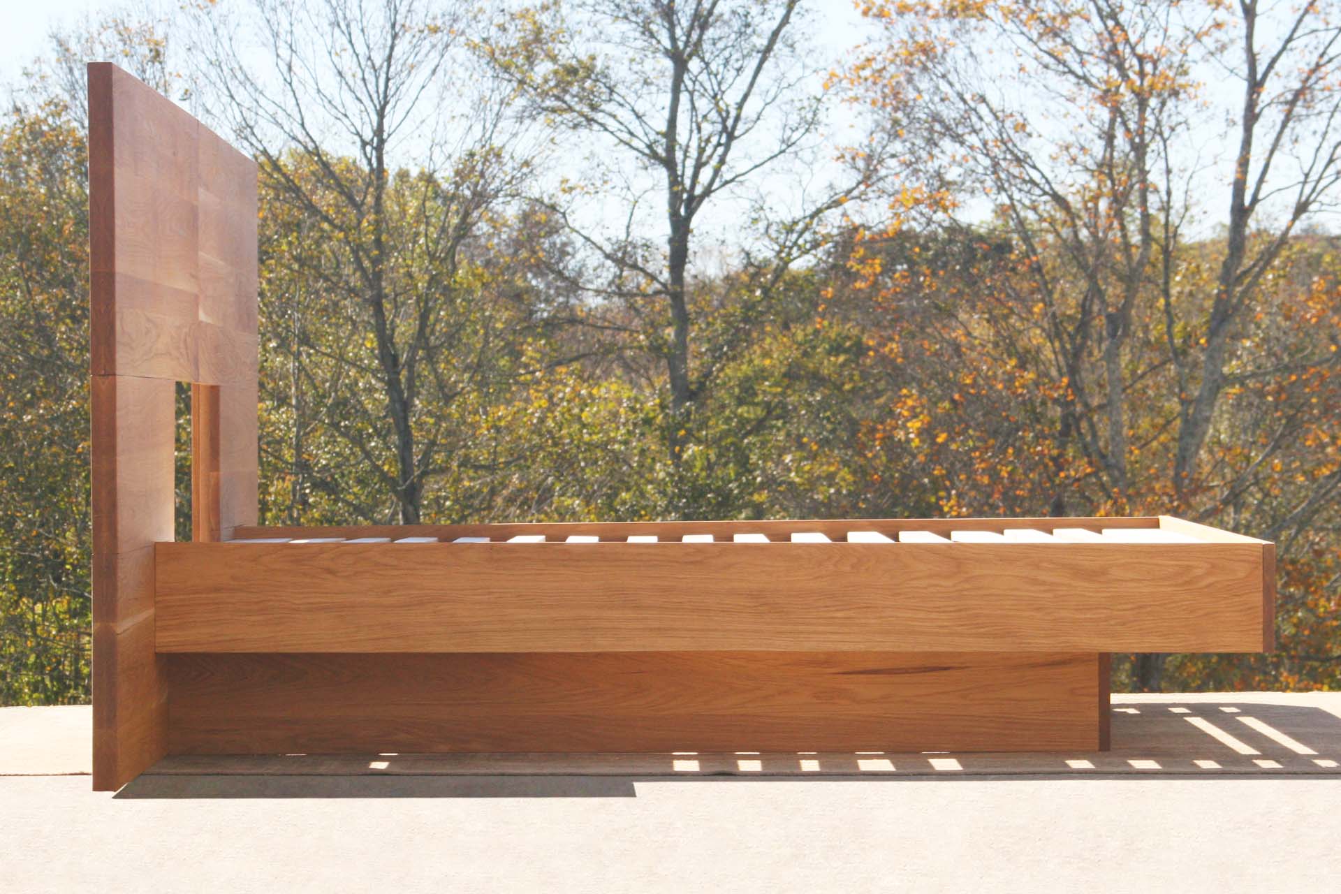 side view wide Cantilever bed with large headboard