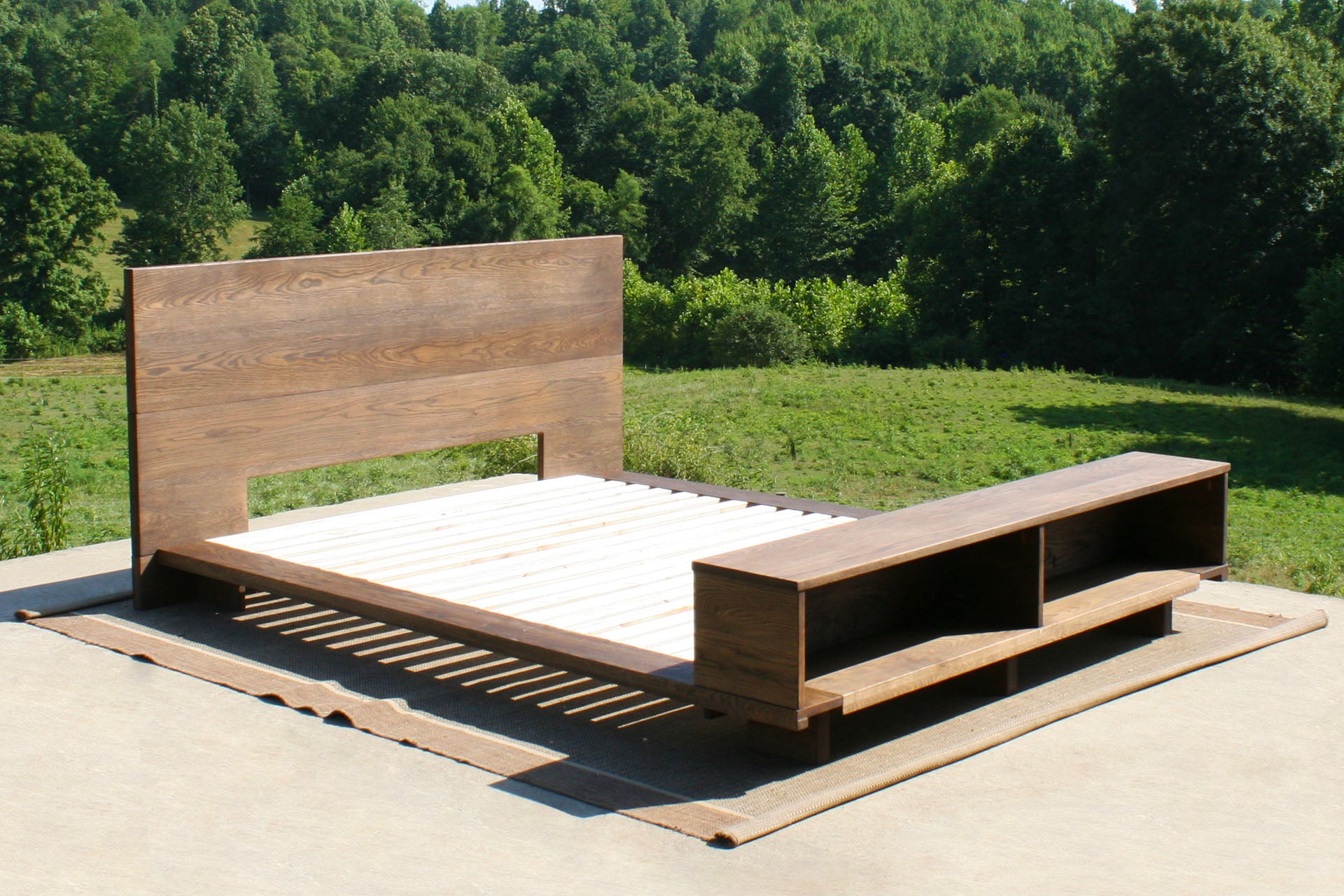 Low platform bed with bookcase foot-end