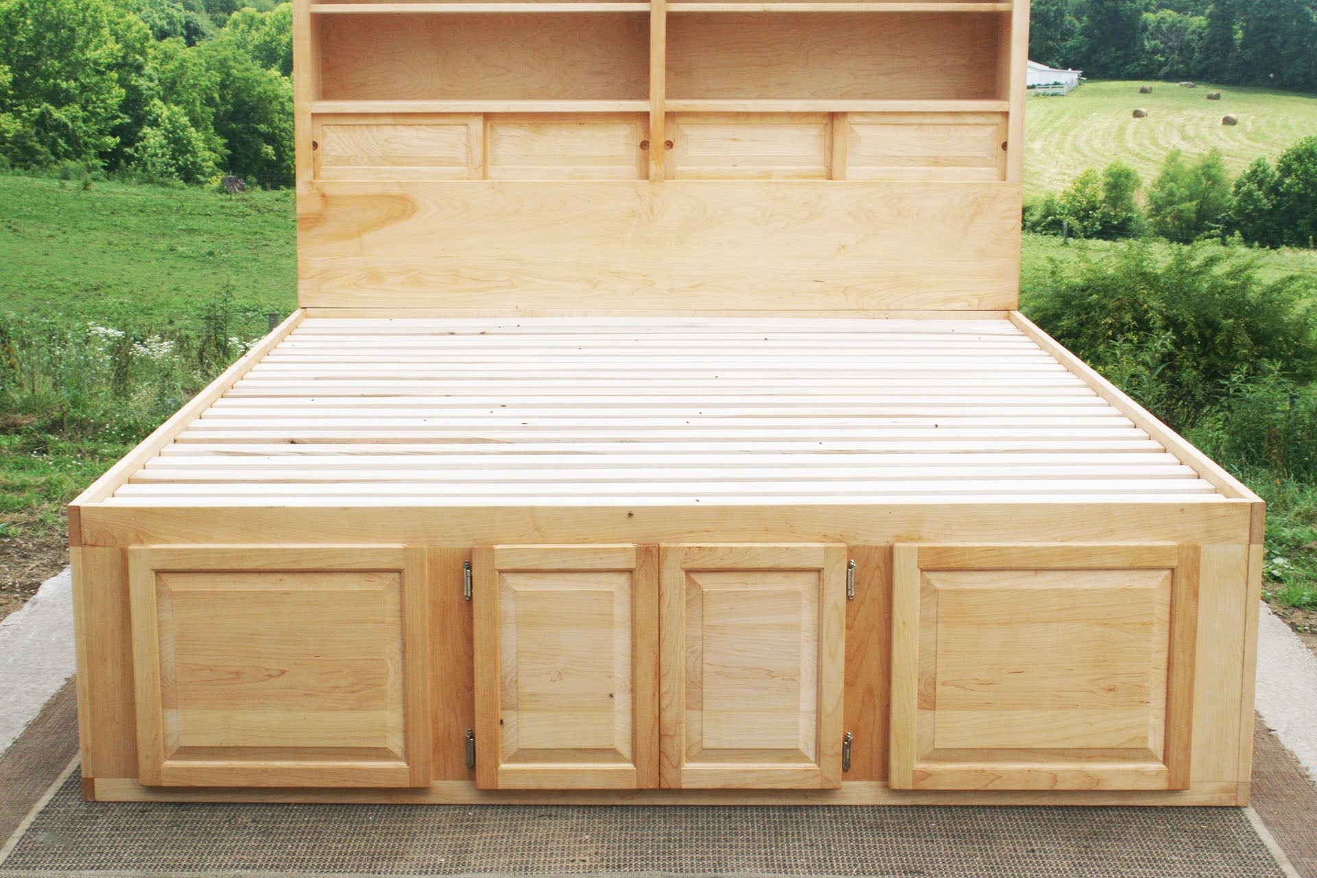 end area of 12 drawer captain's bed with storage headboard