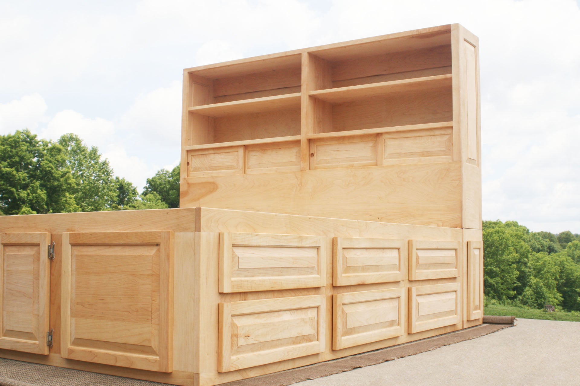 angled view 12 drawer captain's bed with storage headboard