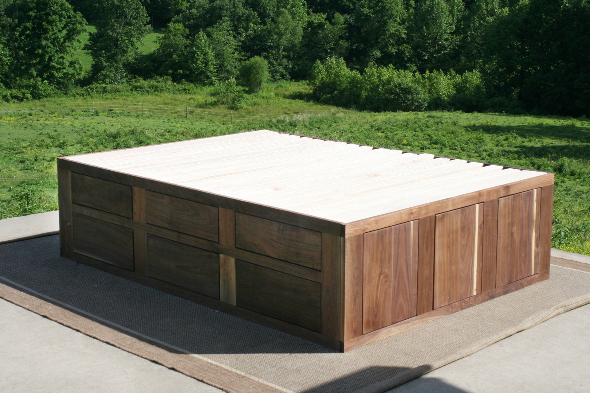 angled view natural Mates bed with 6 drawers on 1 side