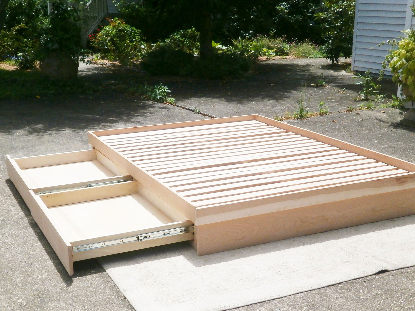 close up wood Low storage bed with 4 drawers 2 drawers out