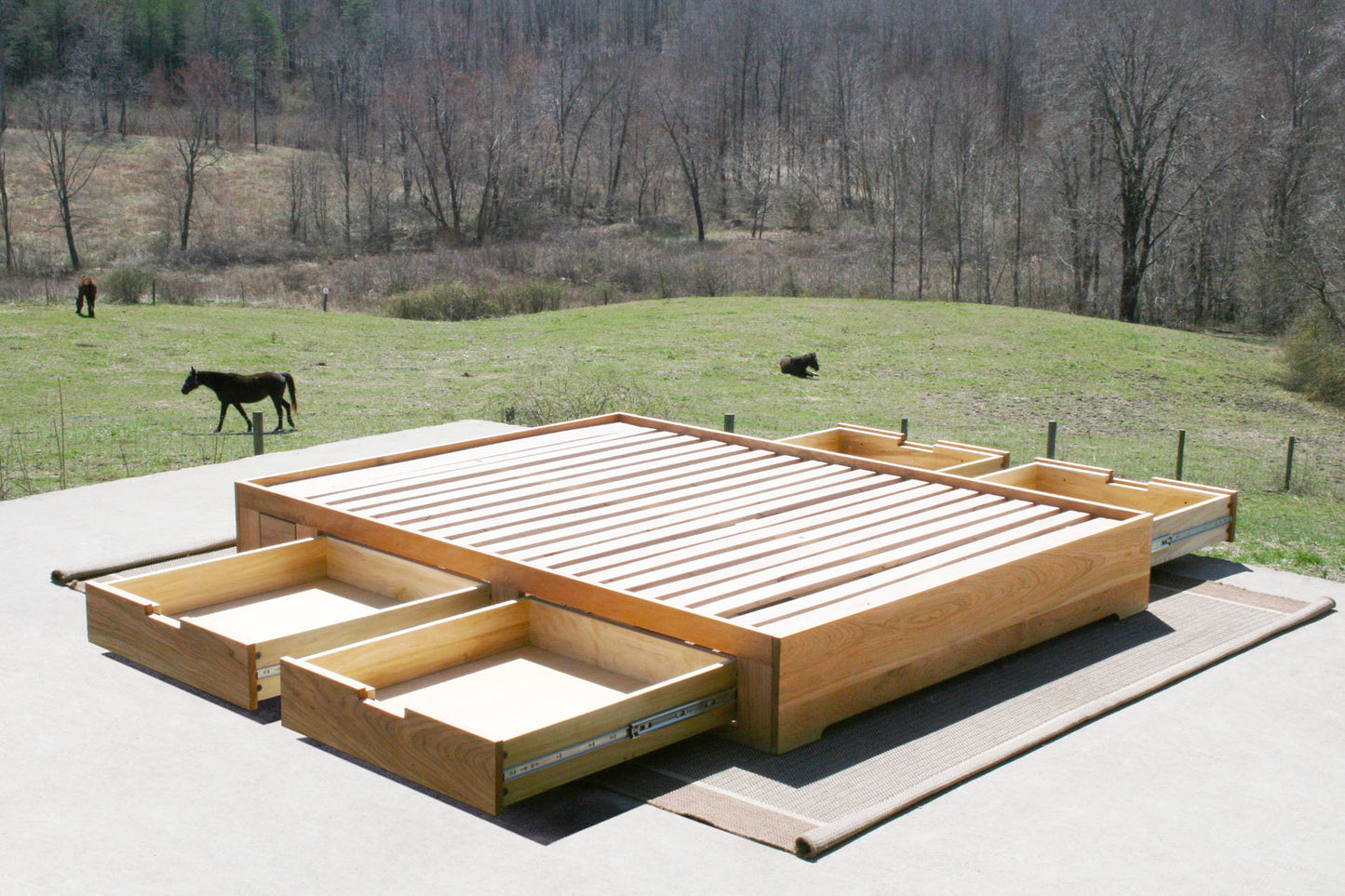 Low profile storage bed with 4 drawers open