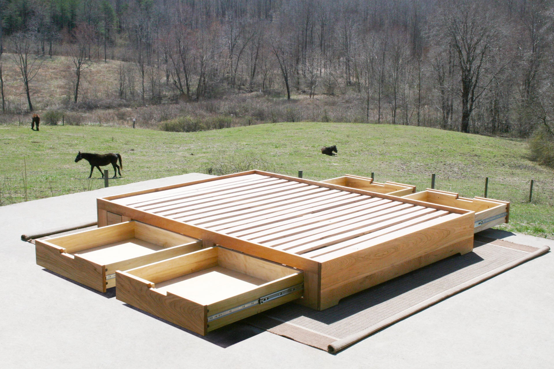 Low profile storage bed with 4 drawers open