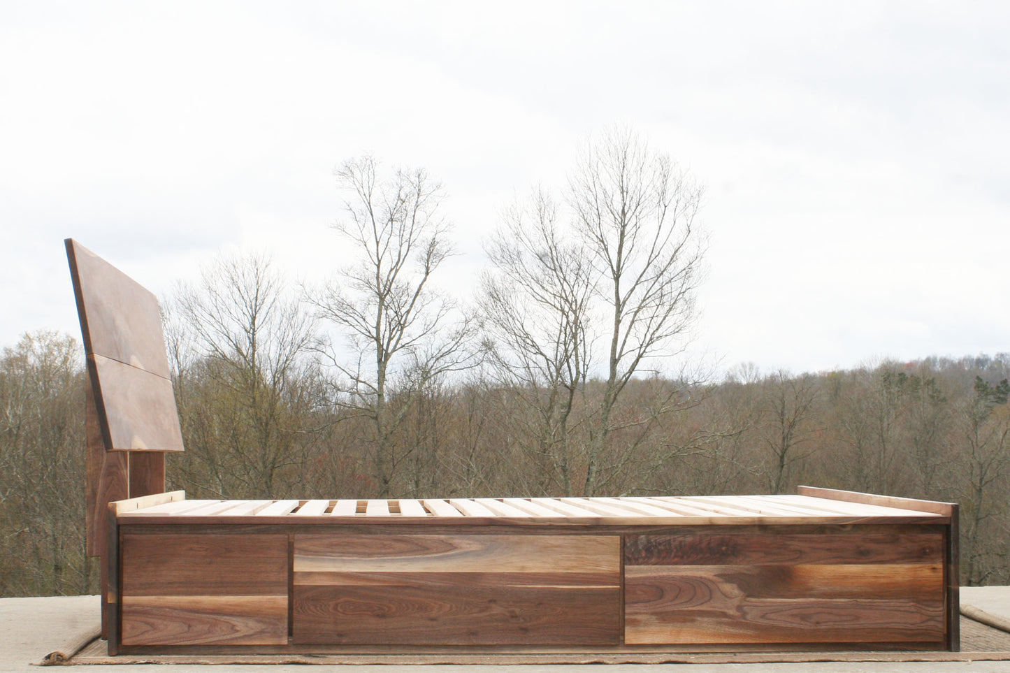 side view walnut Low Storage Bed with 6 drawers and angled headboard