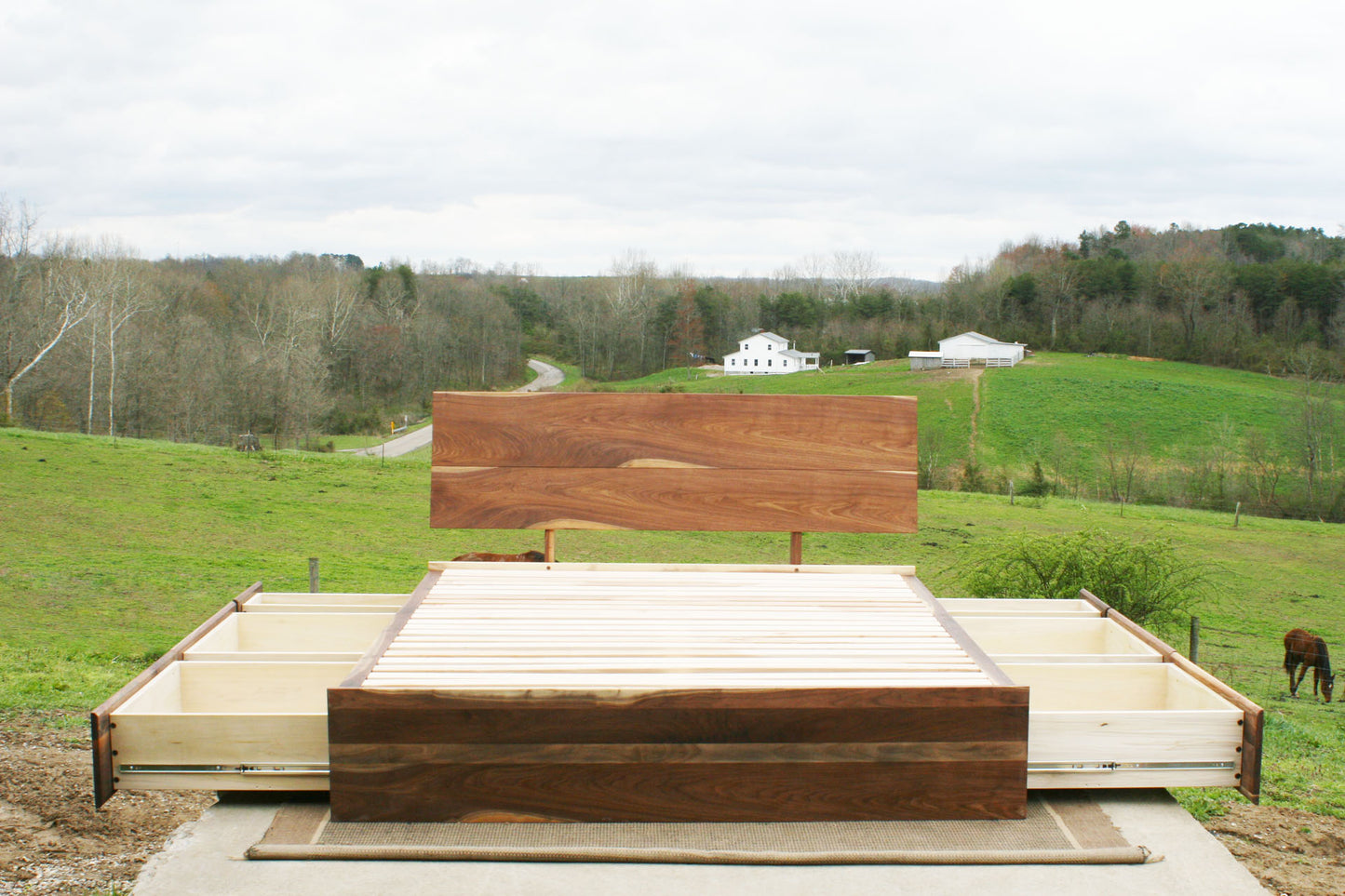 walnut Low Storage Bed with 6 drawers open and angled headboard