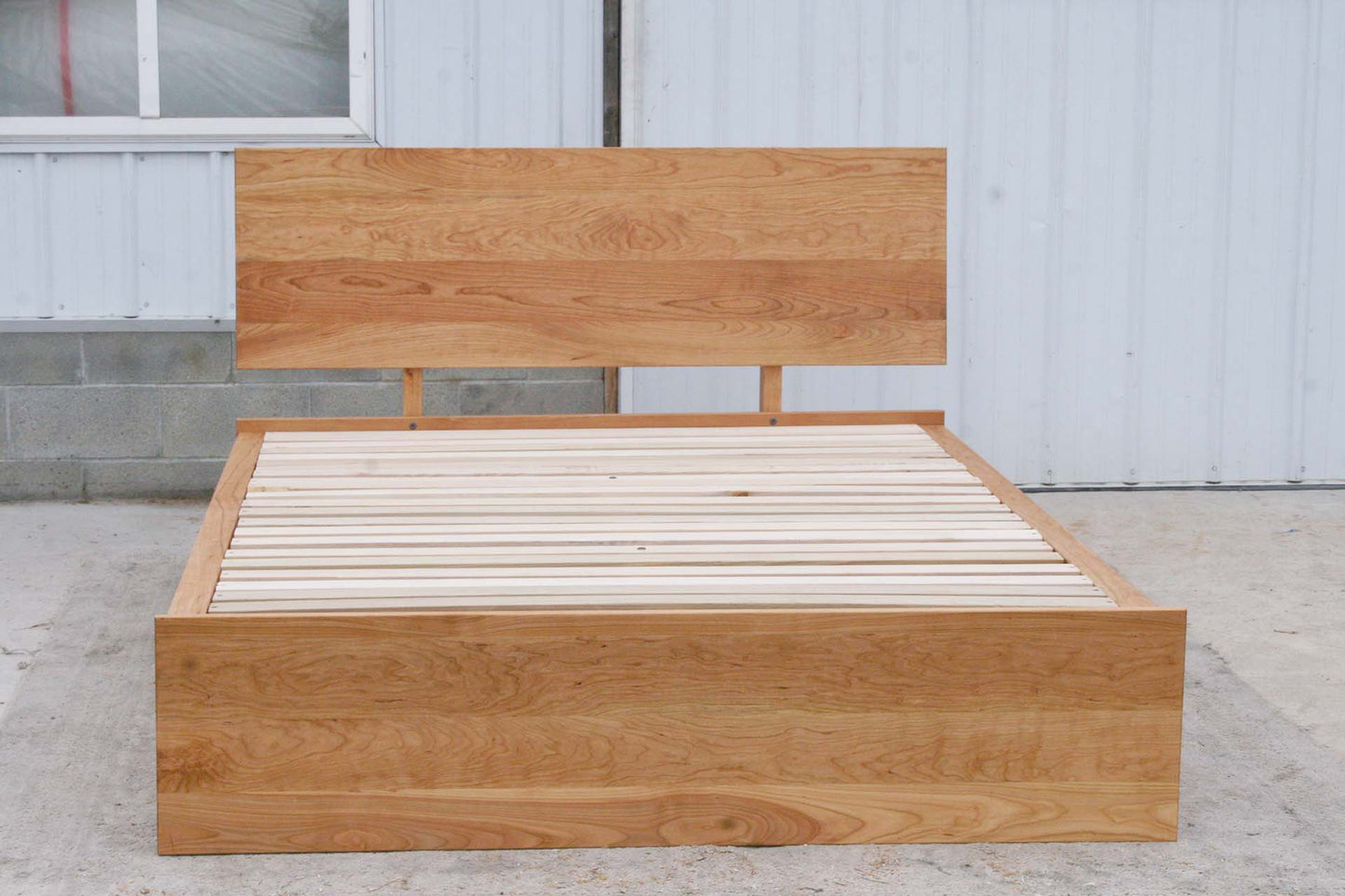 front view natural Low Storage Bed with 6 drawers and angled headboard