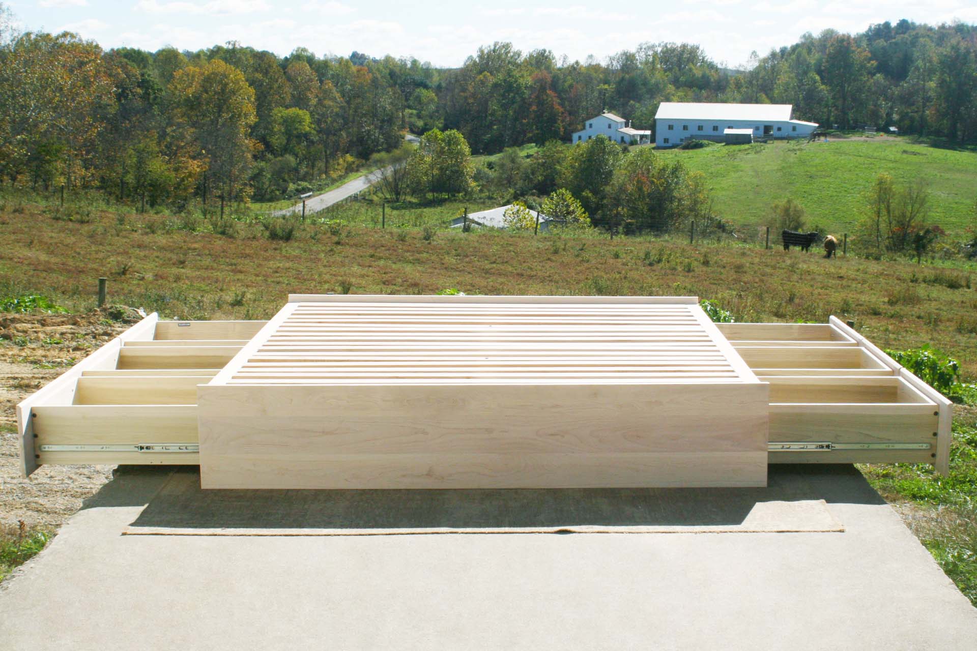 custom natural Platform bed with drawers drawers open front view