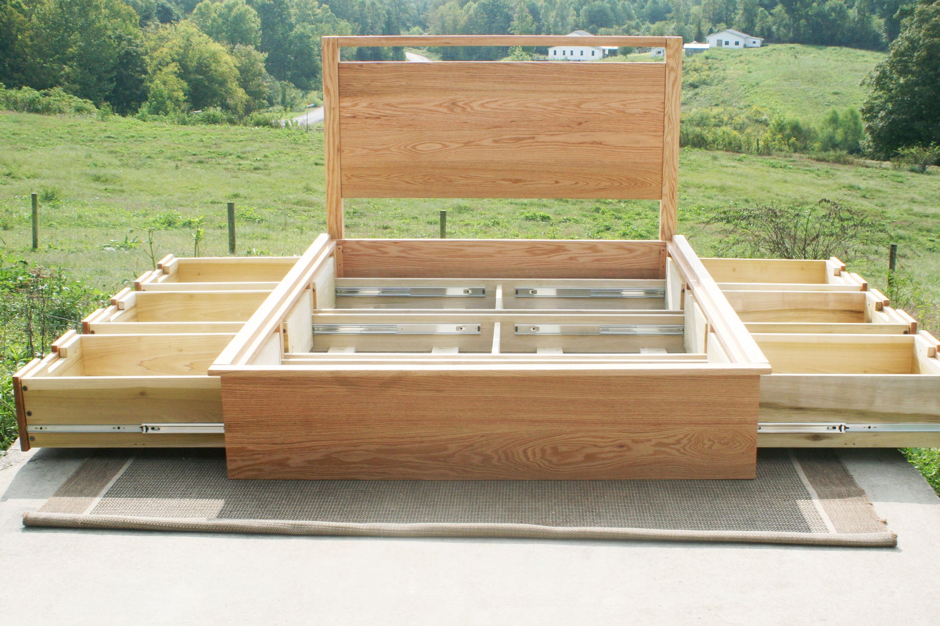 no slats front view Platform Bed with 6 drawers and headboard with top bar with drawers out