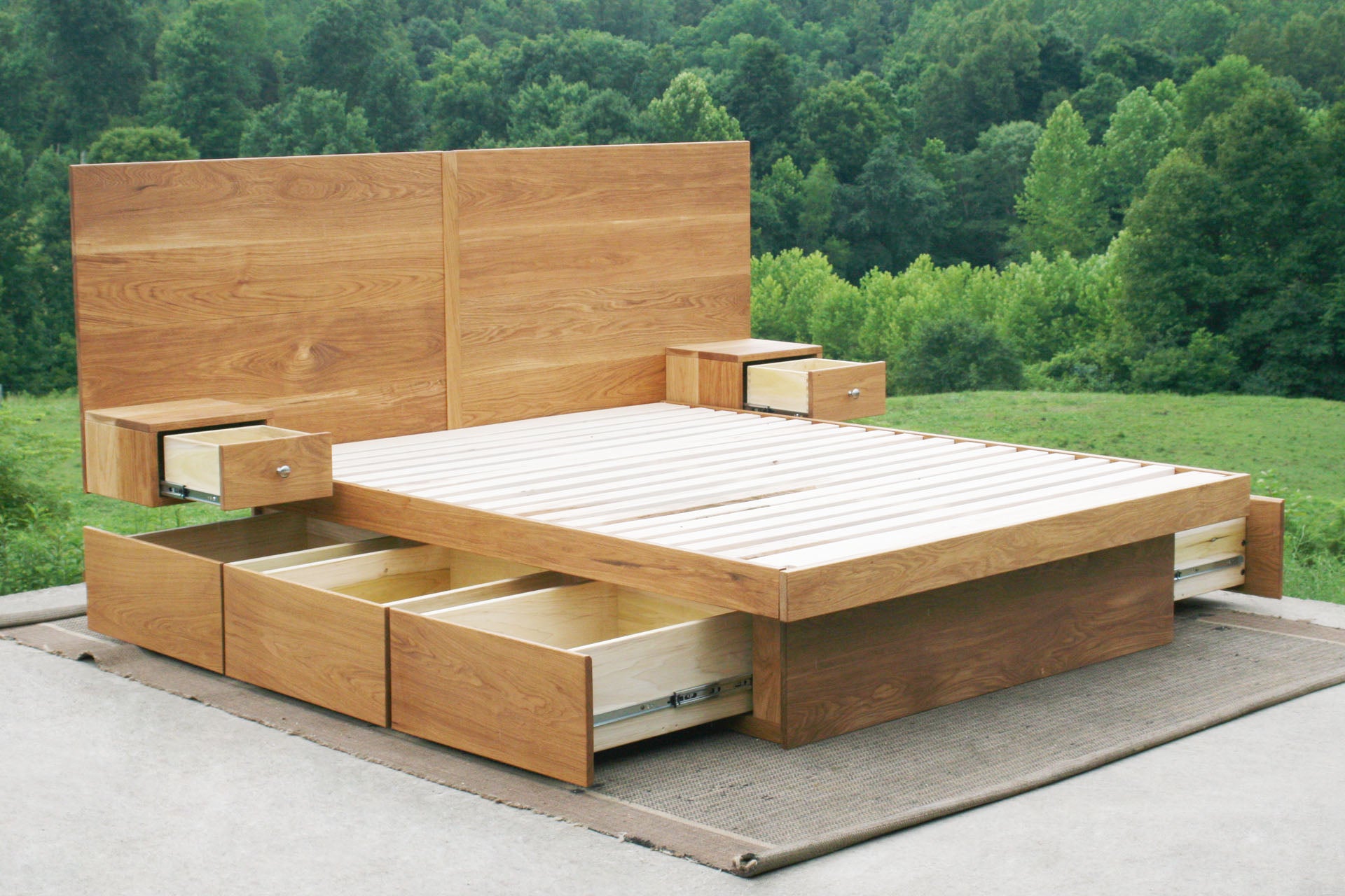 angled view drawers open Storage bed frame with headboard and nightstands wood