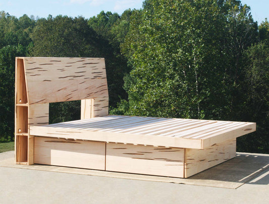 angled view natural four drawer storage bed with headboard storage