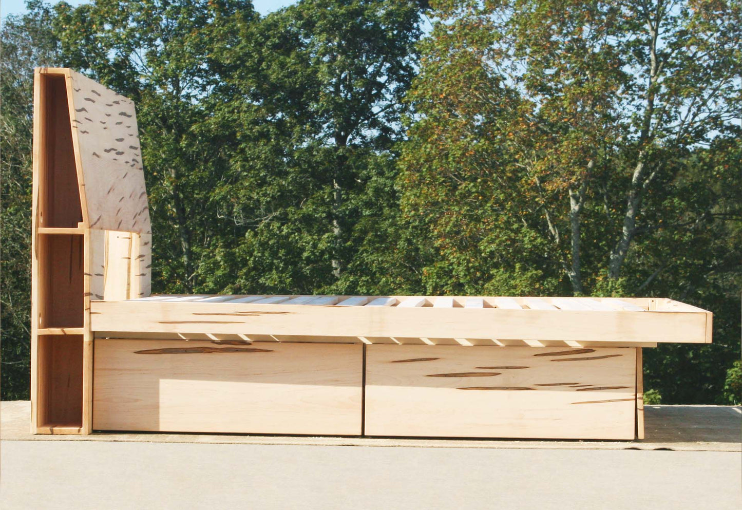 side view natural four drawer storage bed with headboard storage