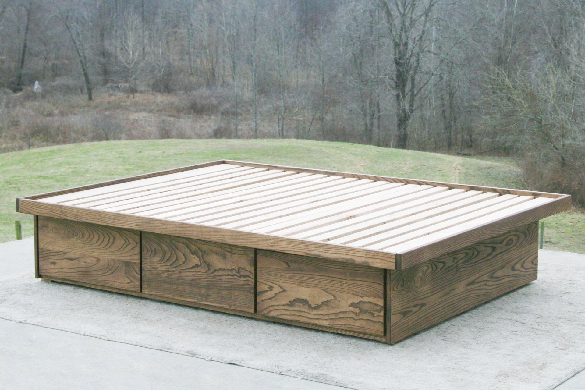 angled view wood Platform Bed with 6 drawers