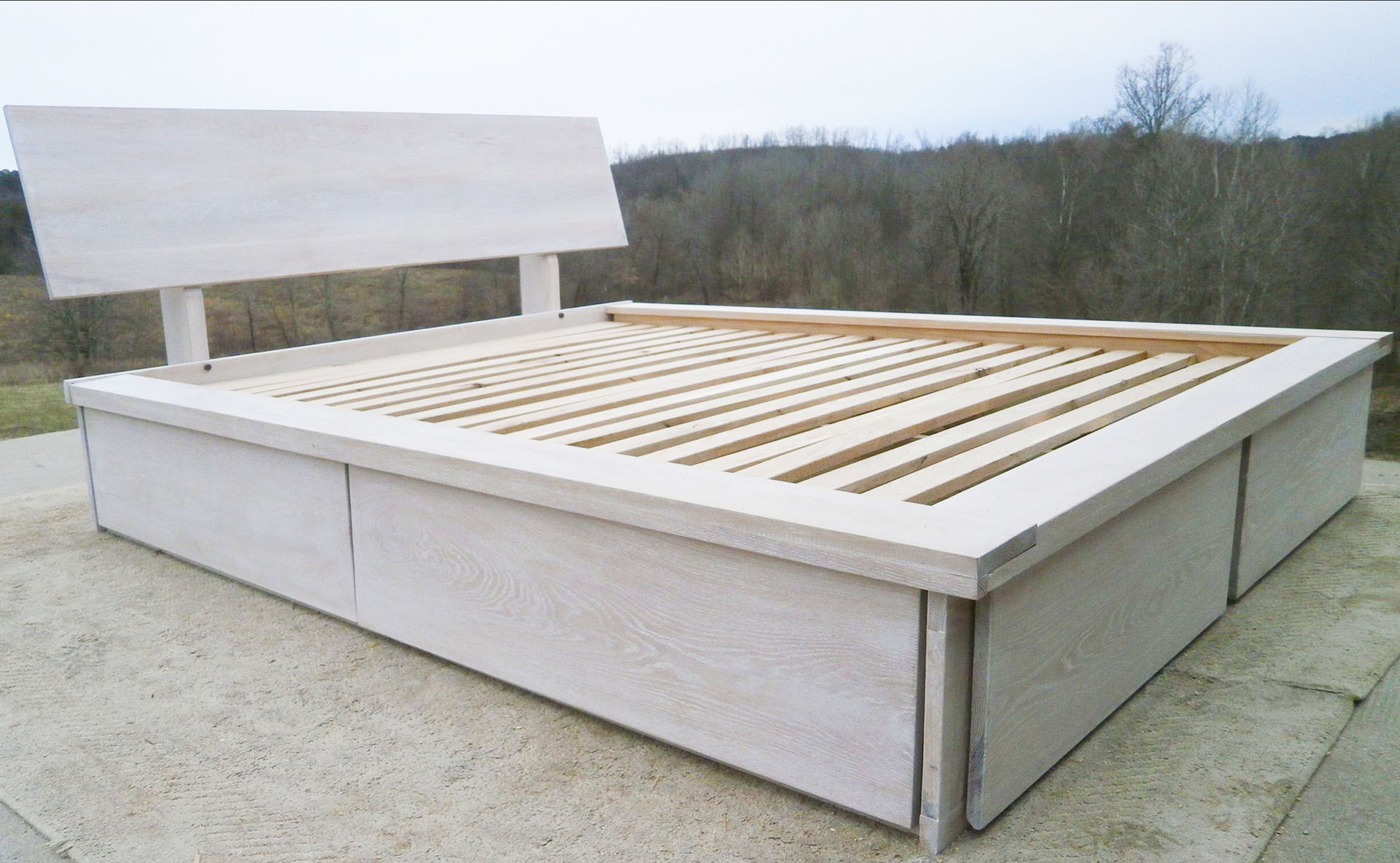front angled view Platform Bed with foot-end drawers, angled headboard and platform extension