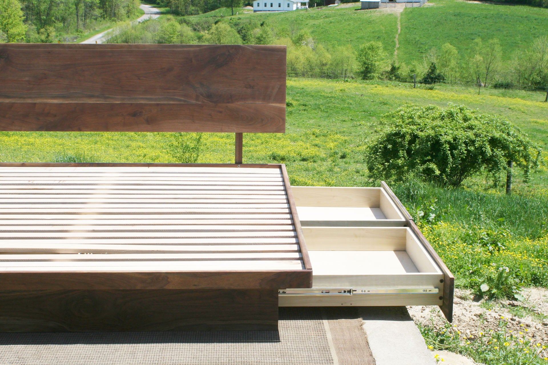 left side of drawers out close up Low platform storage bed with 4 drawers