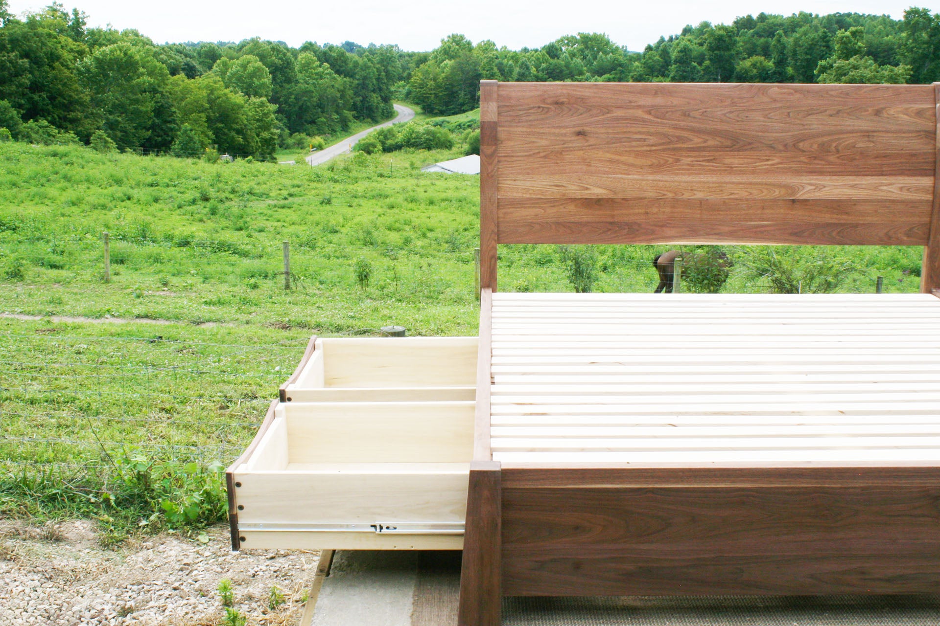 side of Sleigh Platform bed with 4 drawers and large posts 2 drawer open