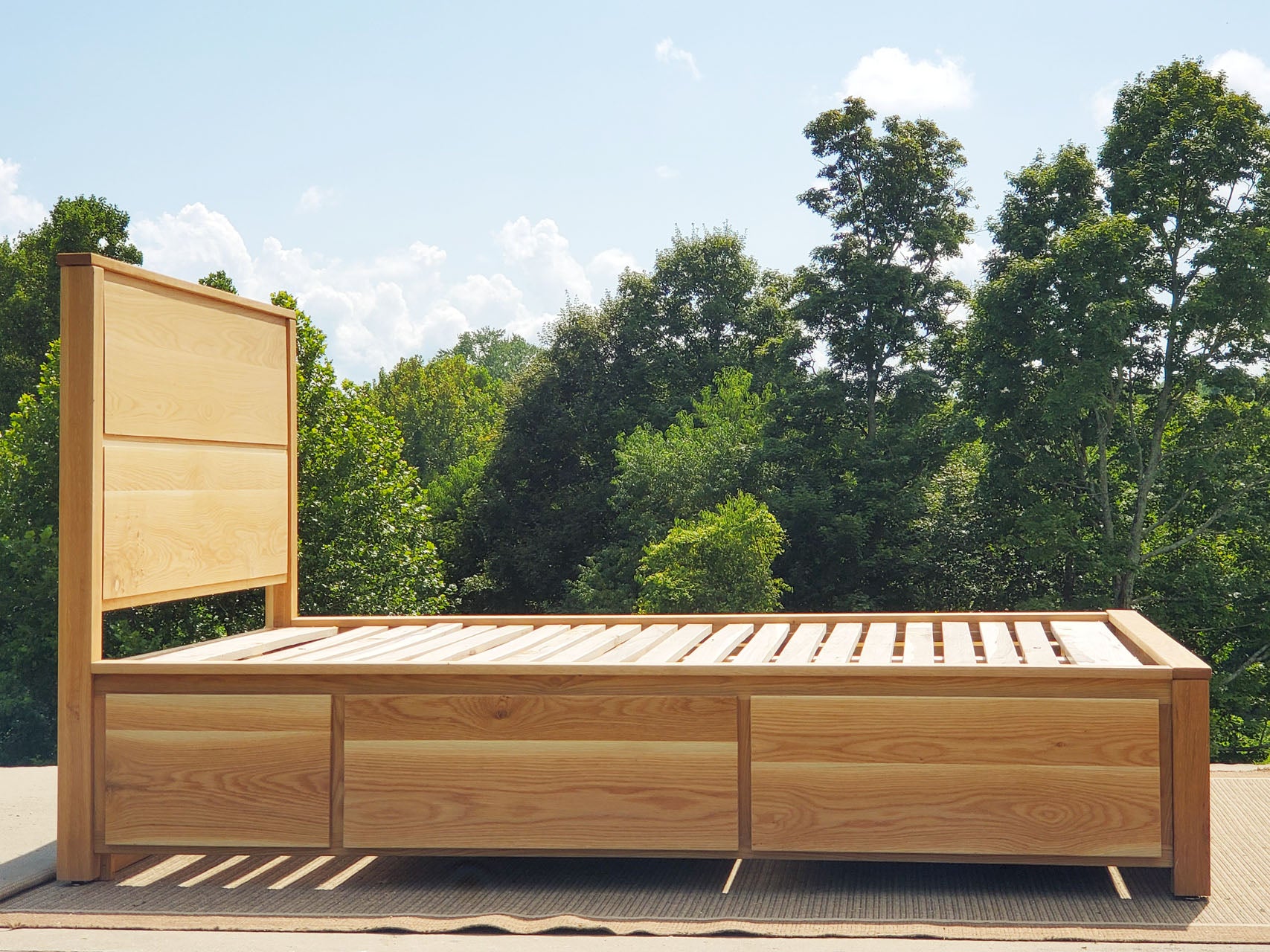 side view Storage Bed with 4 drawers, recessed frame headboard and toe kick