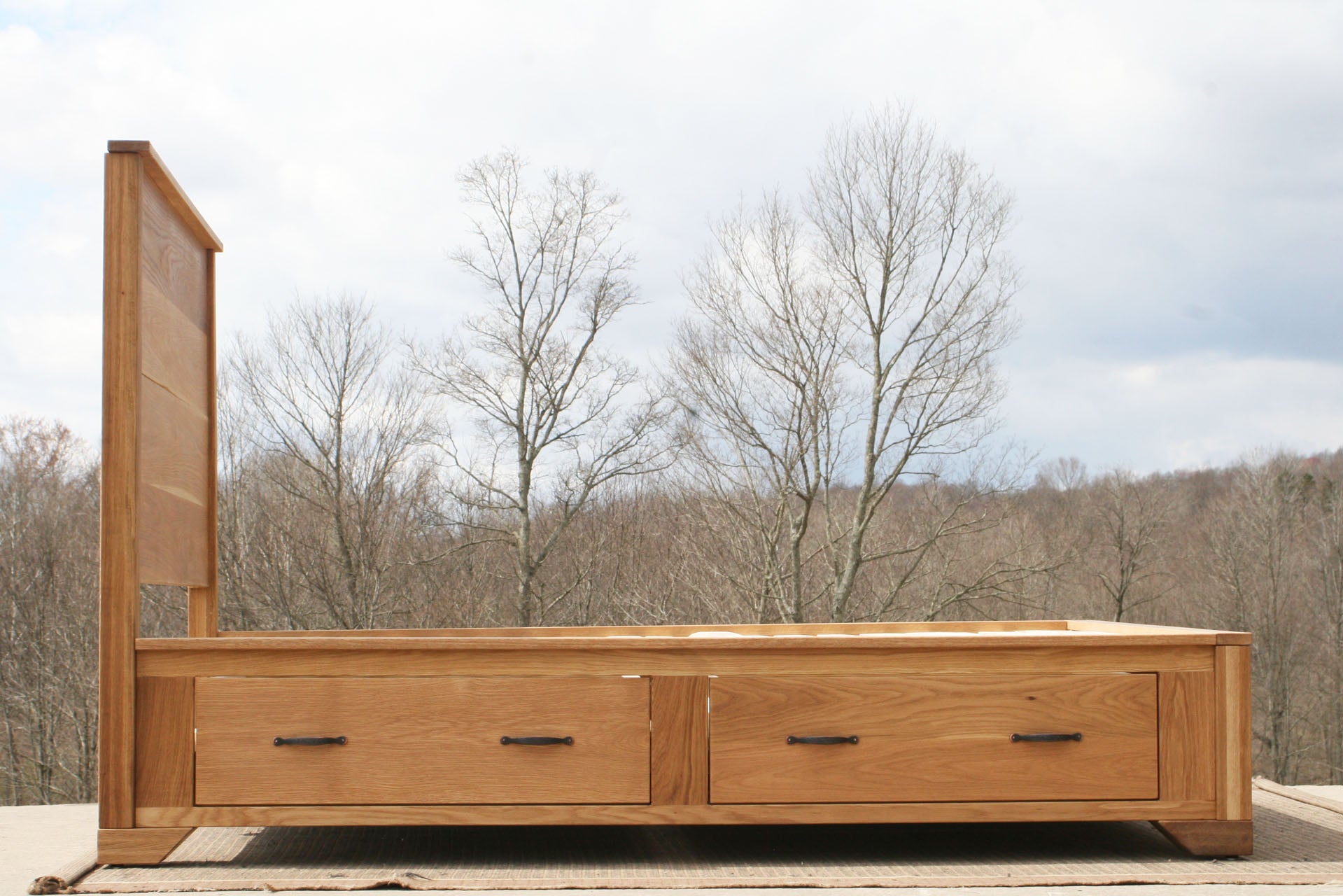 side view Storage Bed with 4 inset drawers and headboard