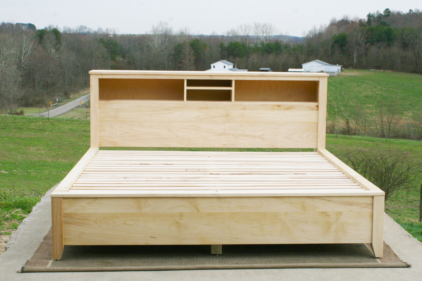 front view Storage bed with bookcase headboard and 4 drawers