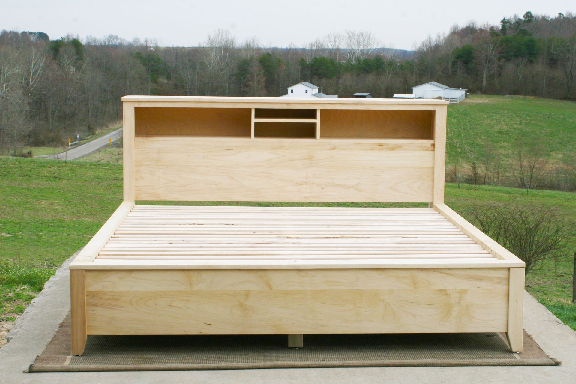 front view Storage bed with bookcase headboard and 4 drawers