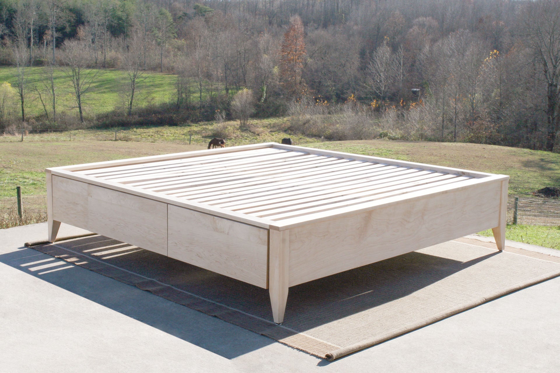 angled view Platform Bed with 4 drawers and tapered feet