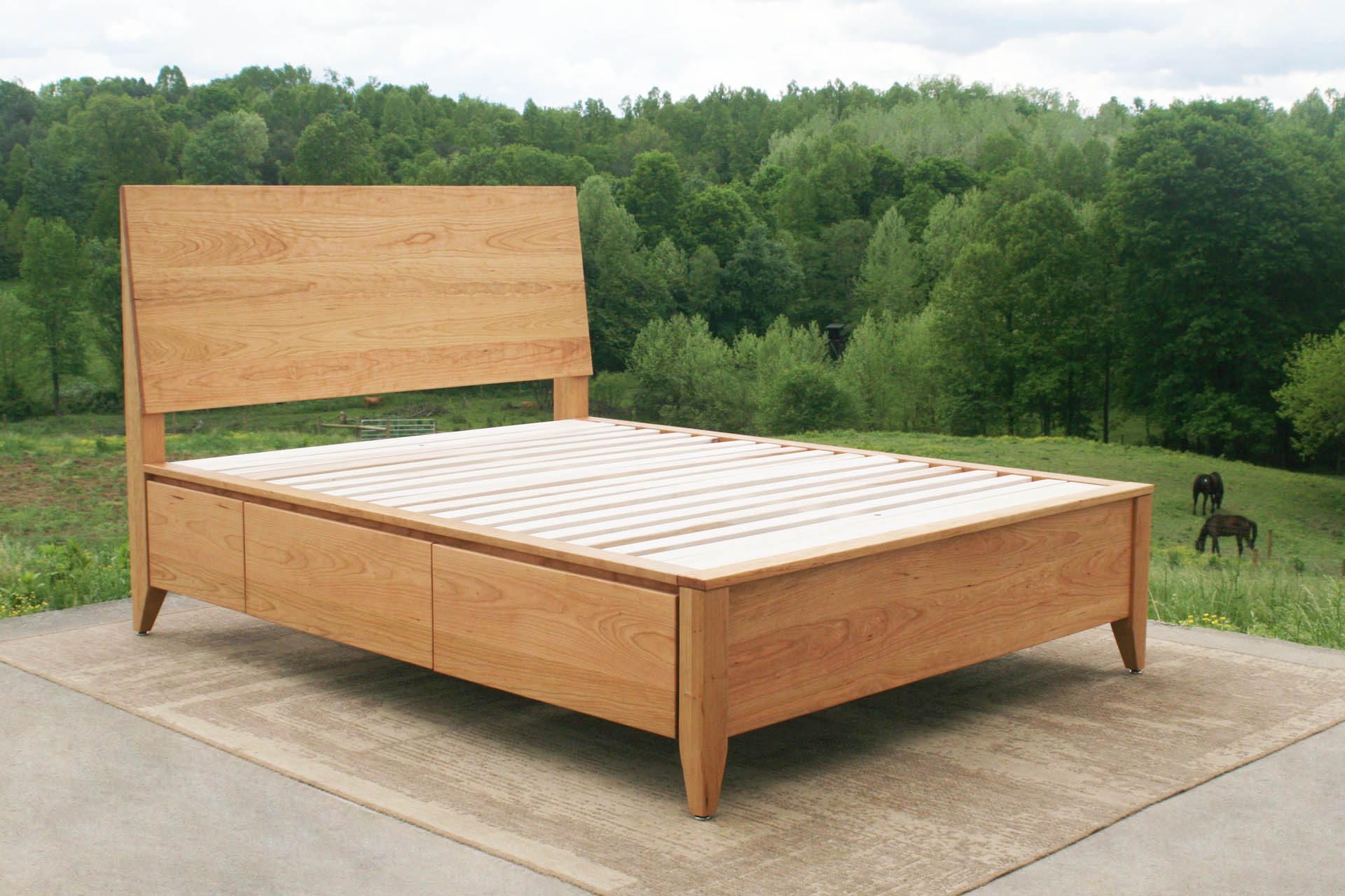angled view Platform storage bed with headboard
