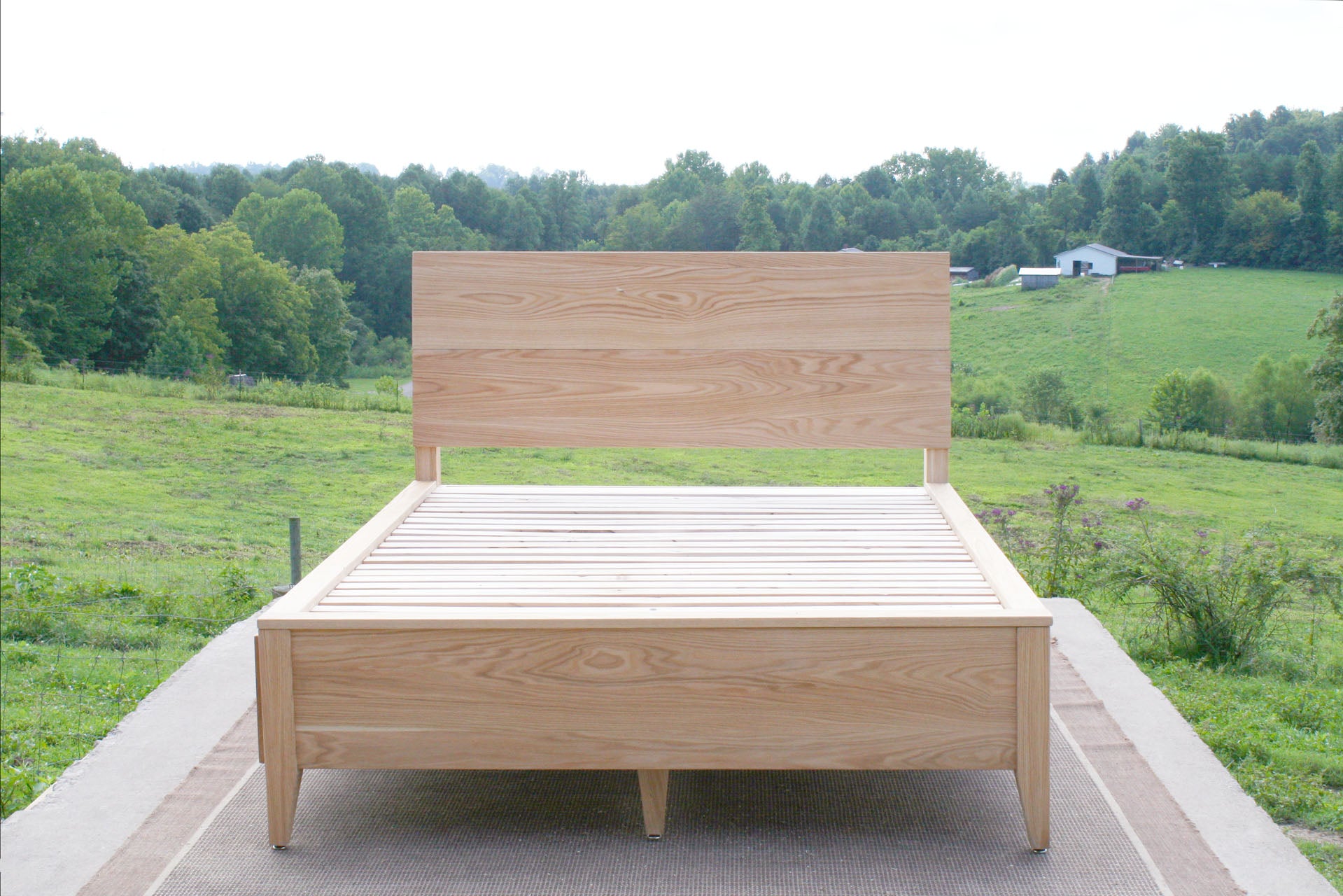 natural hardwood front view Platform storage bed with headboard