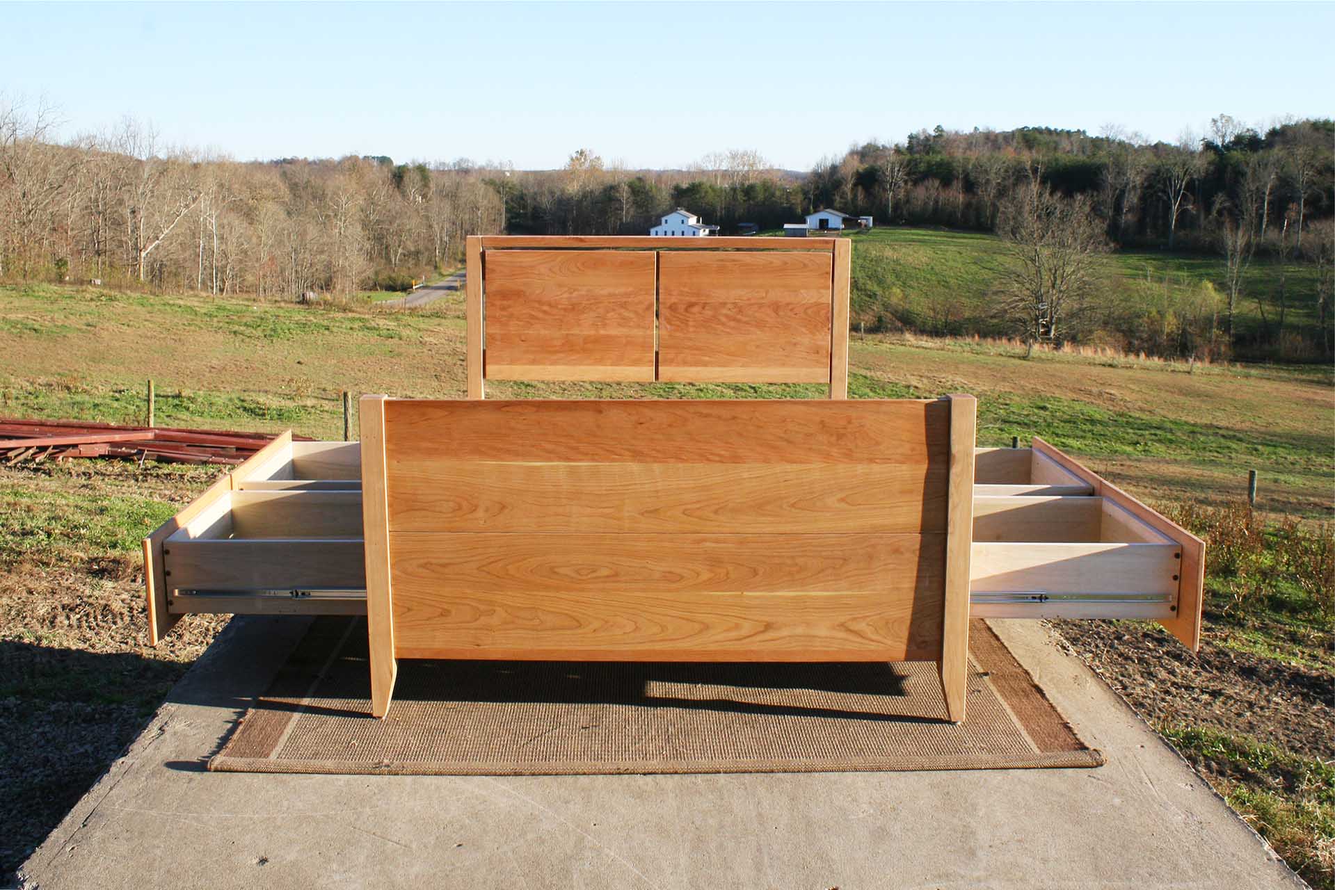 end of storage bed with cubby with drawers open