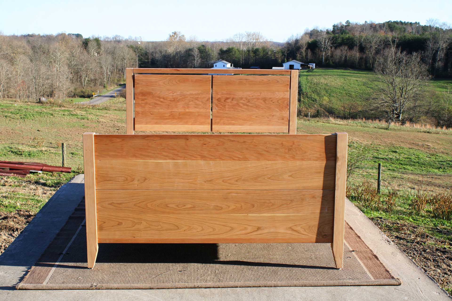 Platform Bed with 4 drawers, 2 cubbies, split-panel headboard and solid footboard front view