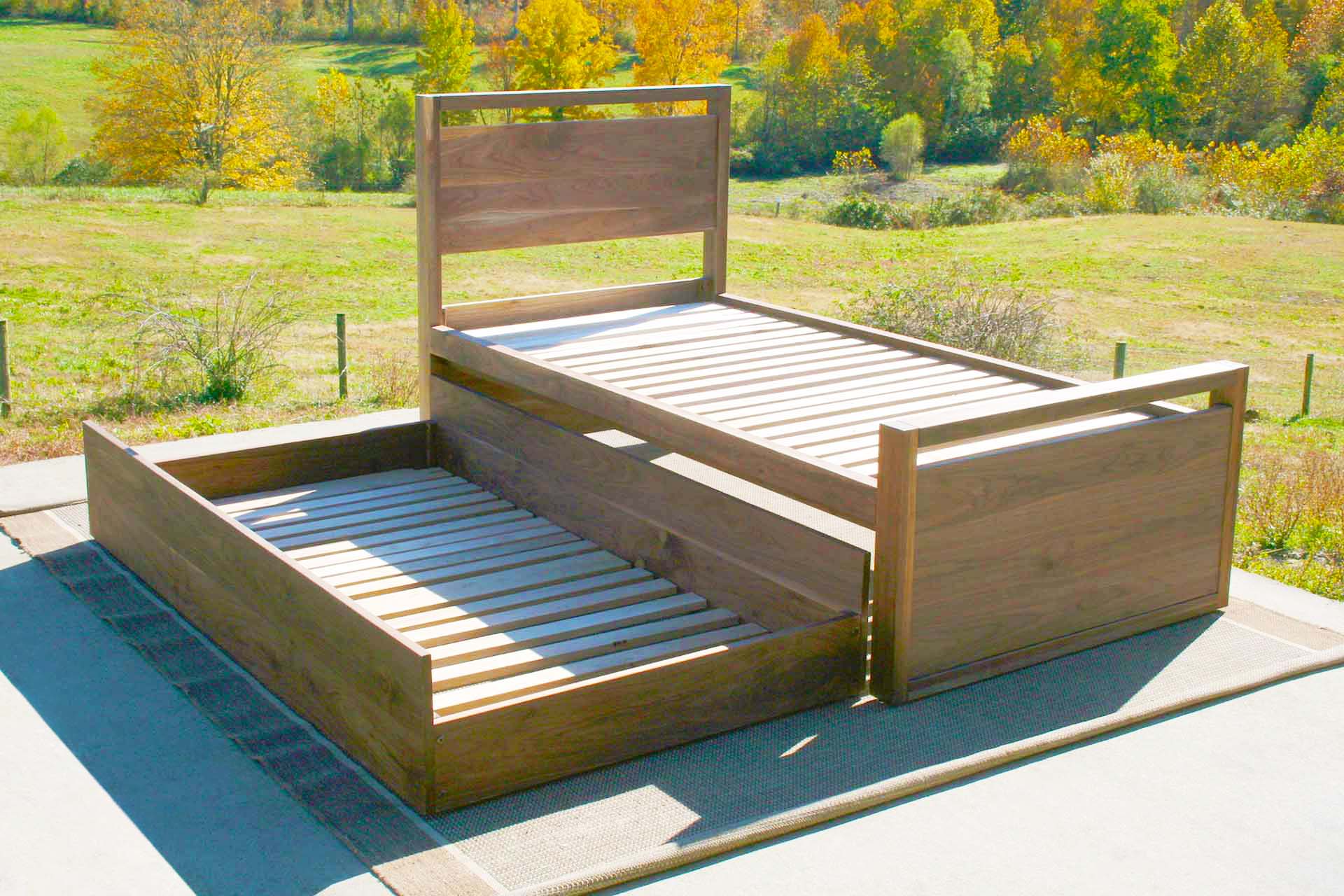 angled view Trundle Bed with top rails on headboard and footboard angled view