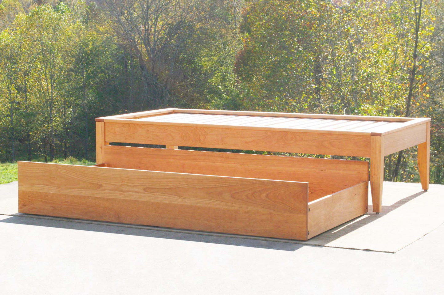 trundle out angled view custom Trundle bed with platform top cap trim