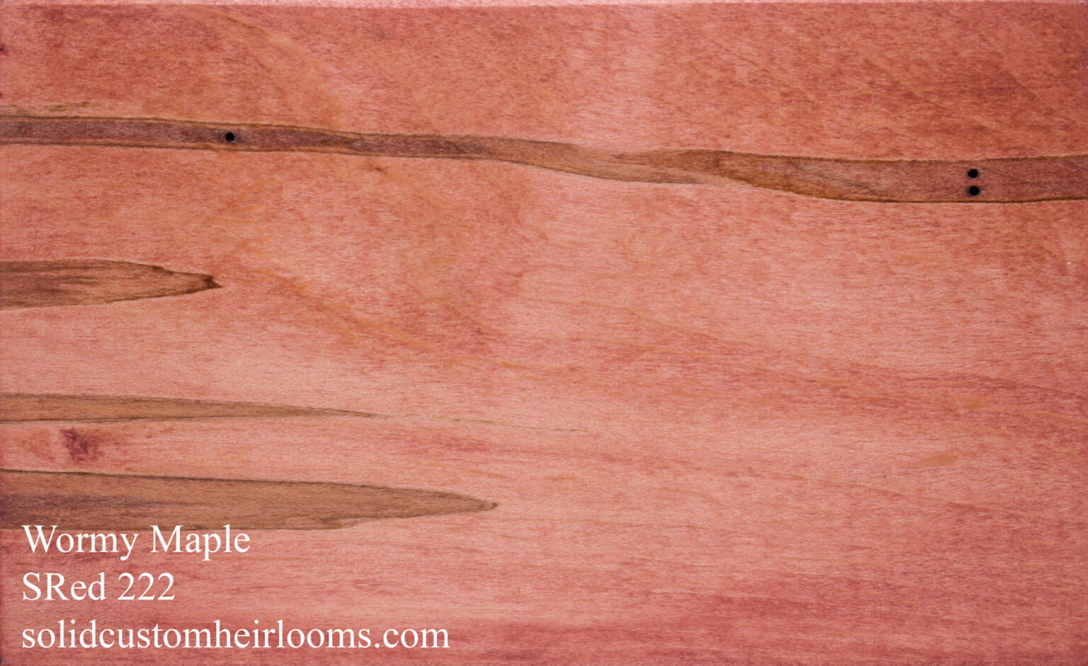 wormy maple with a faded pale red stain