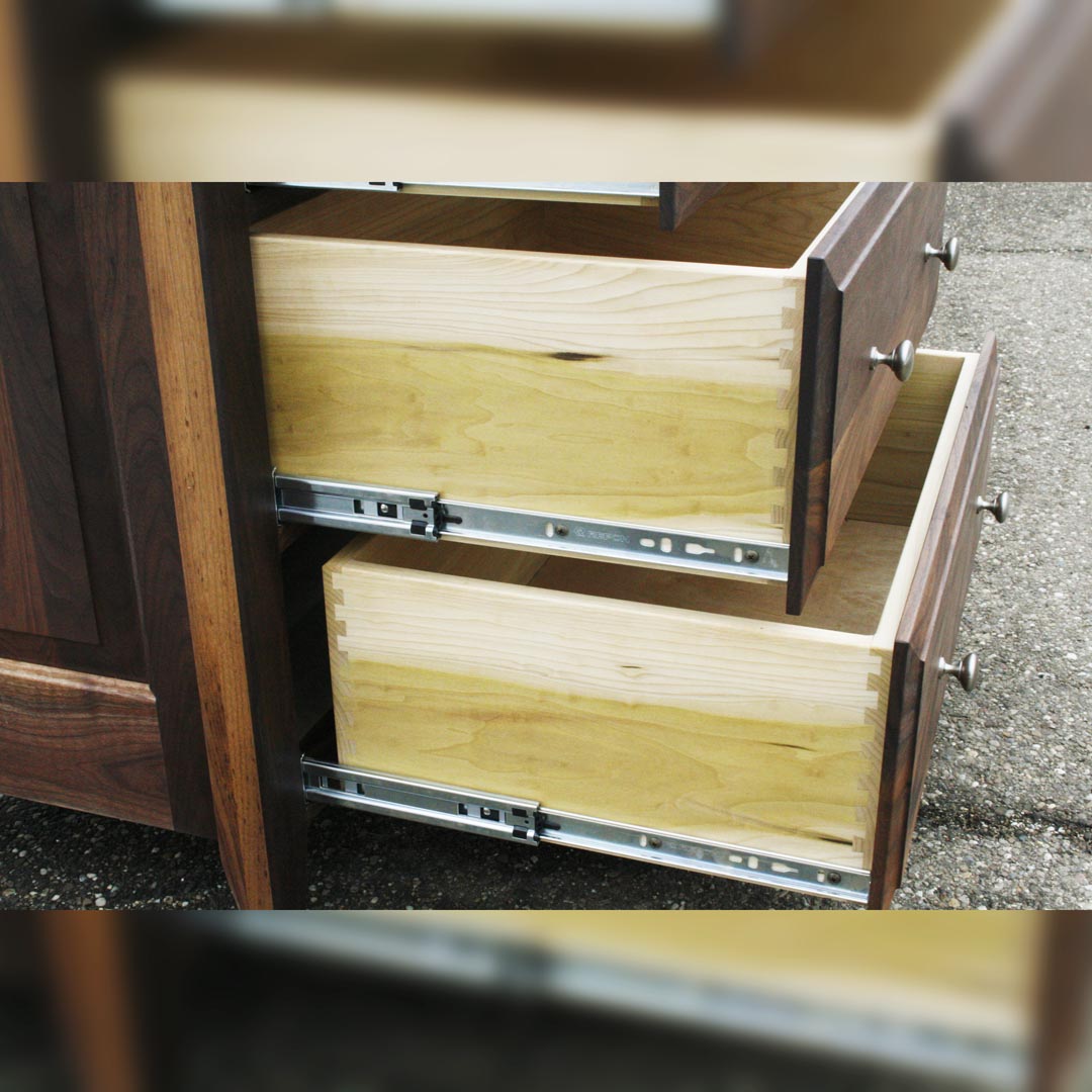drawers of natural wood dresser with tracks