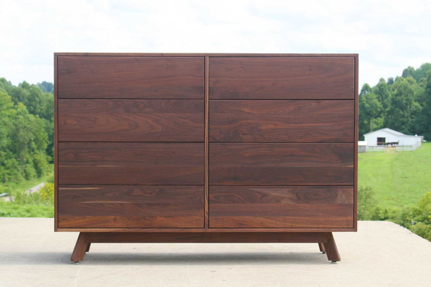 modern dresser with angled legs maple front view