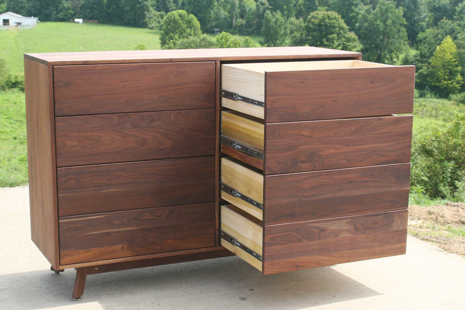 maple modern dresser with angled legs  and drawers out front view