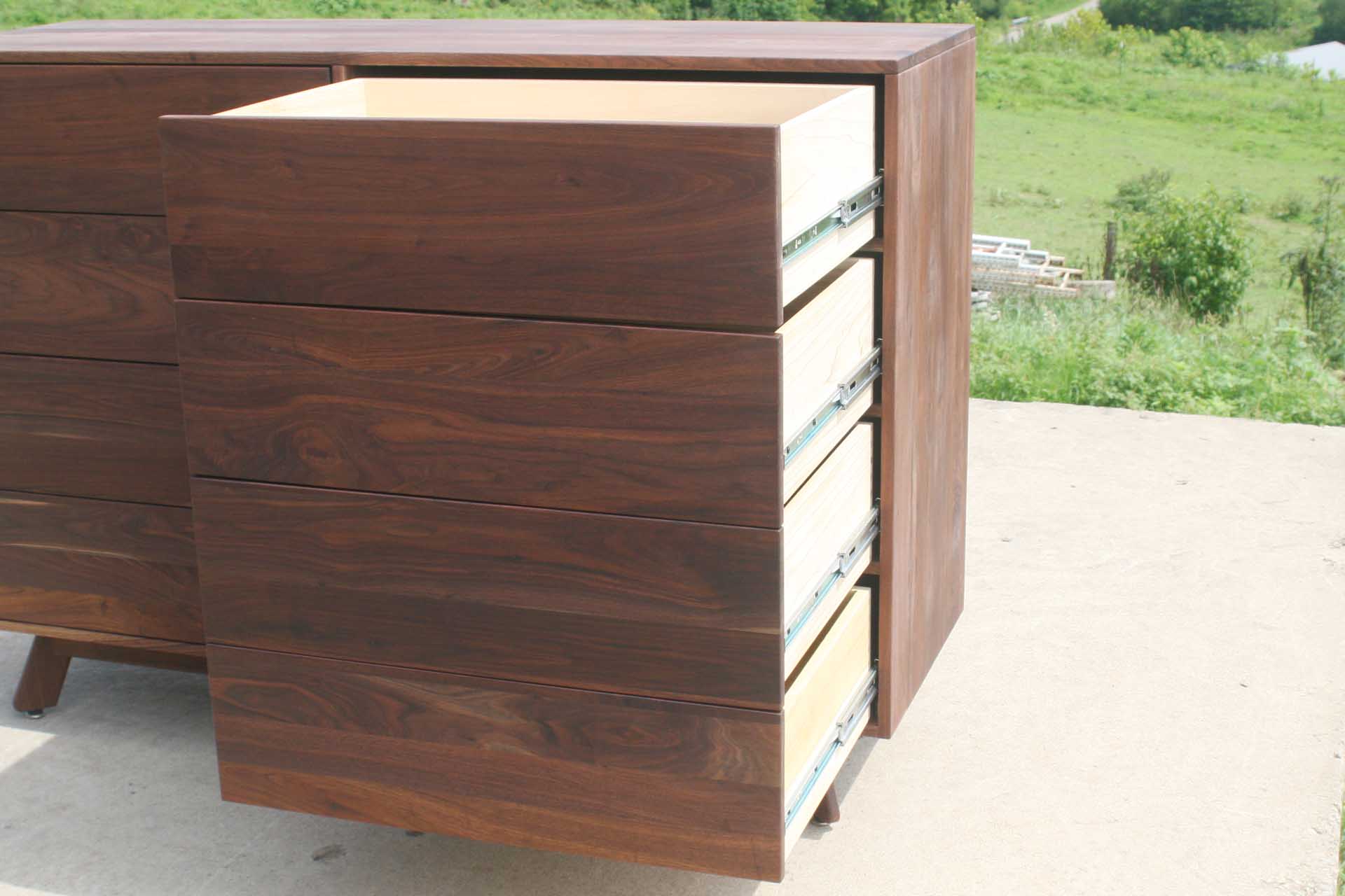 close up solid hardwood 8 drawer dresser drawers open no handles