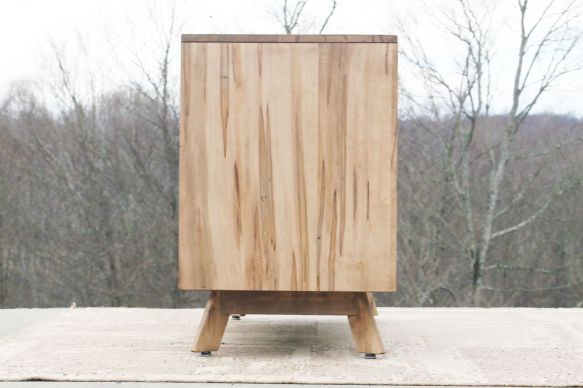 side of Modern dresser with angled legs