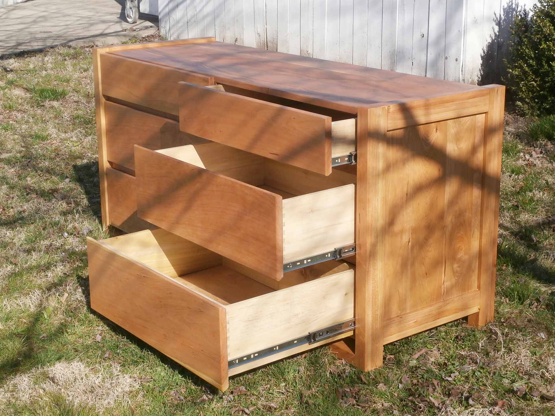 side view right most drawers extended of framed dresser
