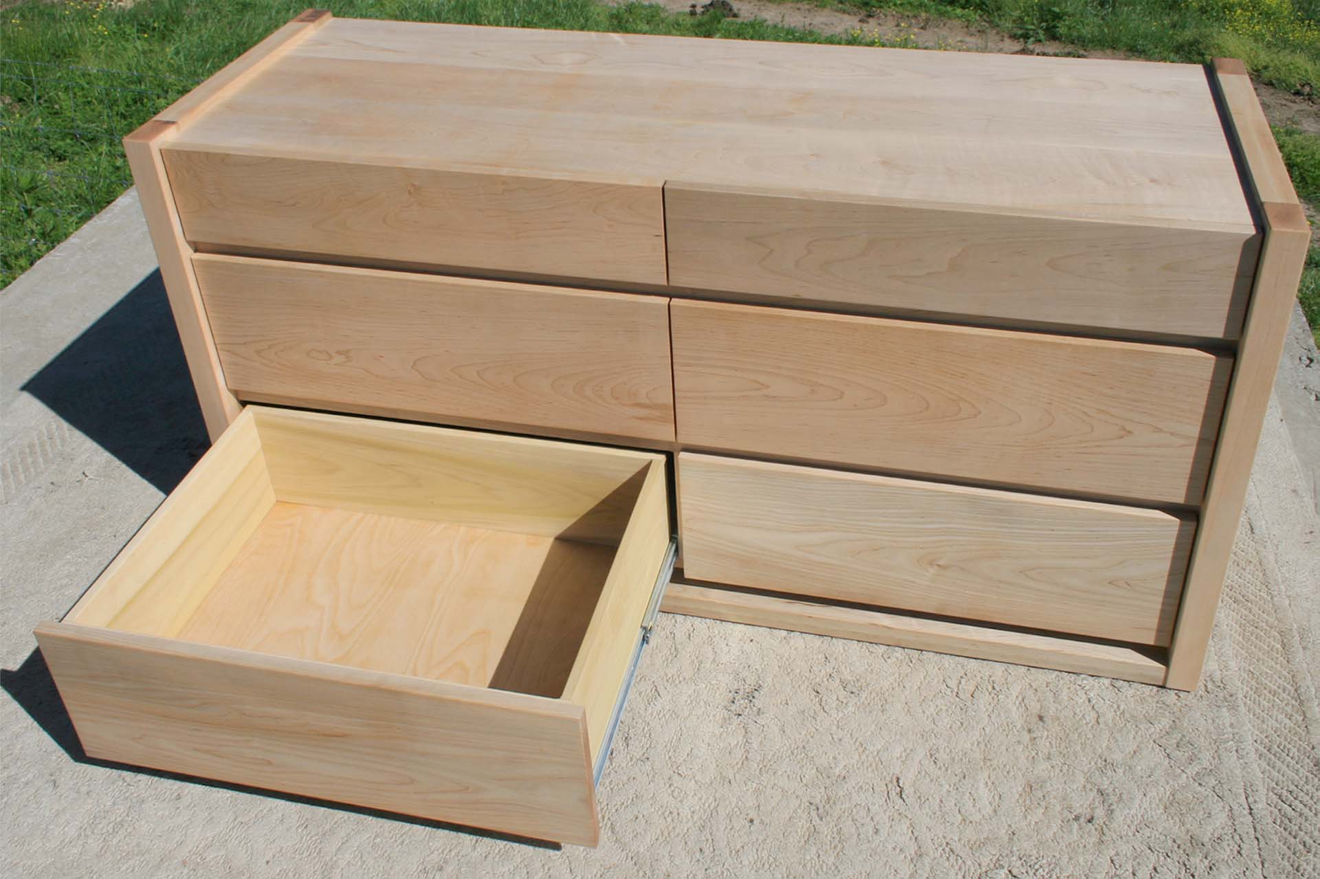 left bottom drawer extended birds eye view paneled dresser