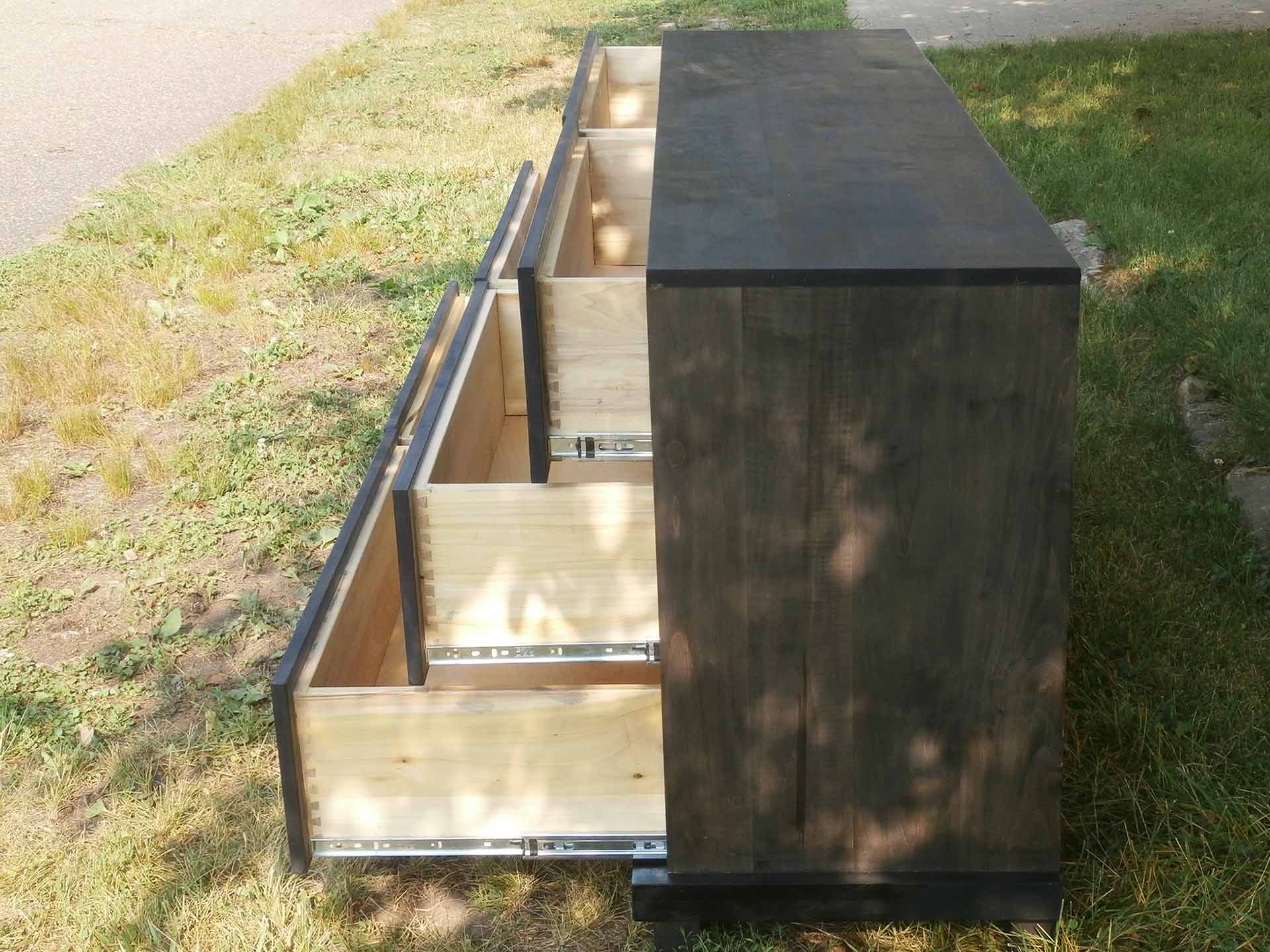 side view drawers extended of hardwood dresser American made