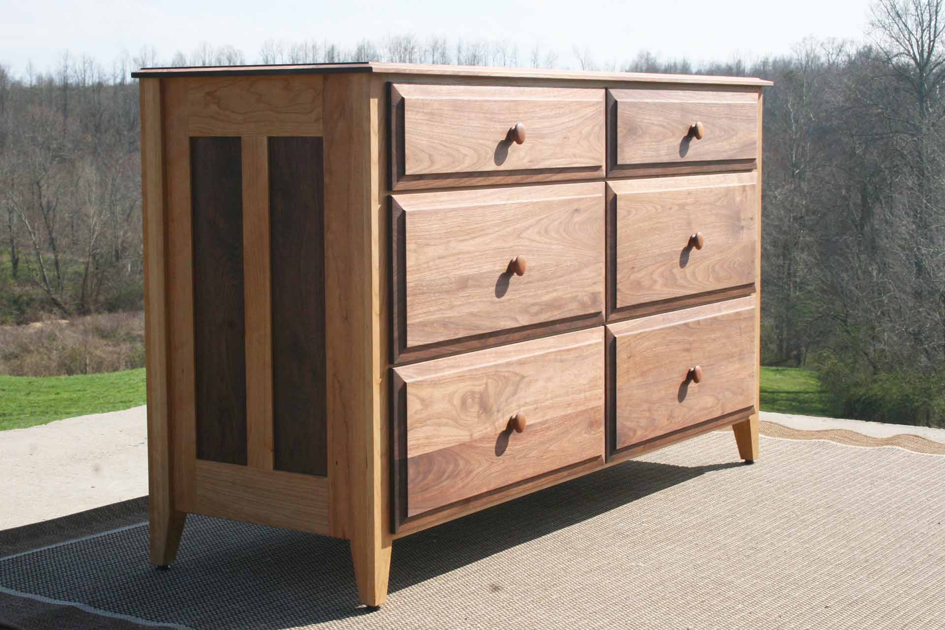 angle view solid natural hardwood dresser with paneled ends