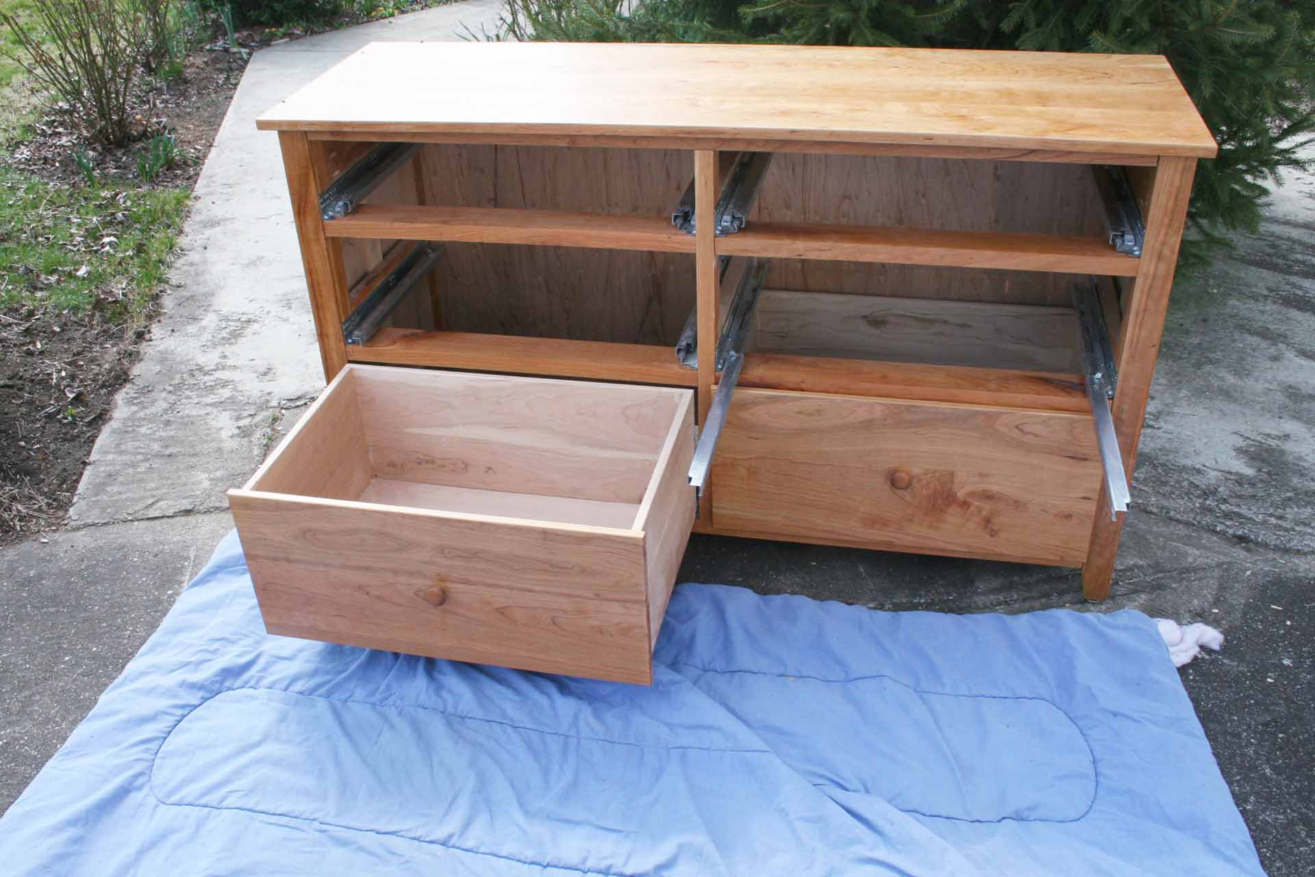 disassembled 6 drawer hardwood dresser without most drawers