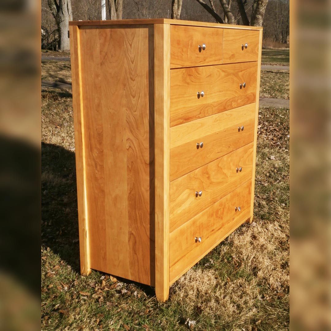 angled view hardwood dresser with 6 drawers and round handles