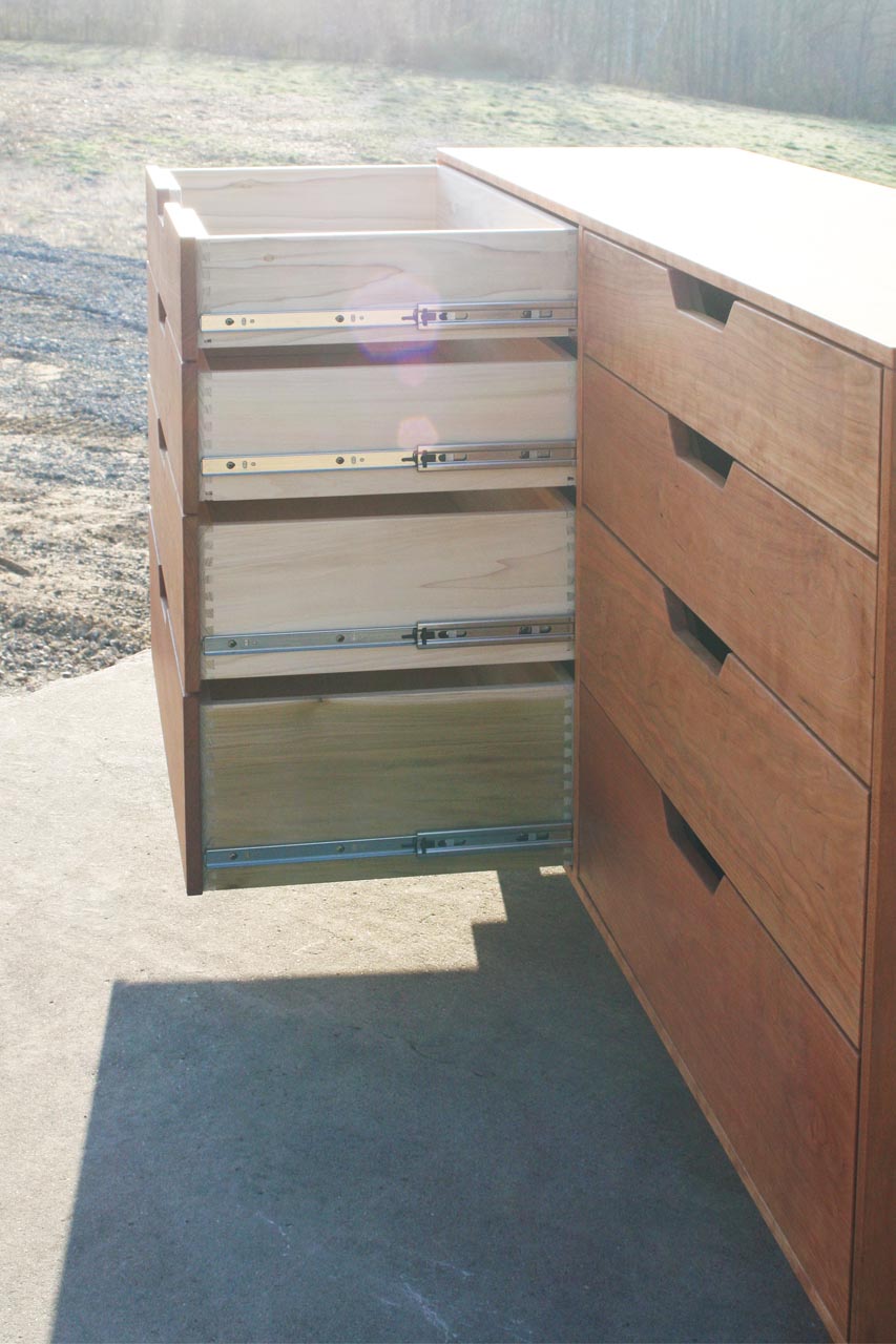 drawers open close up Cherry wood dresser