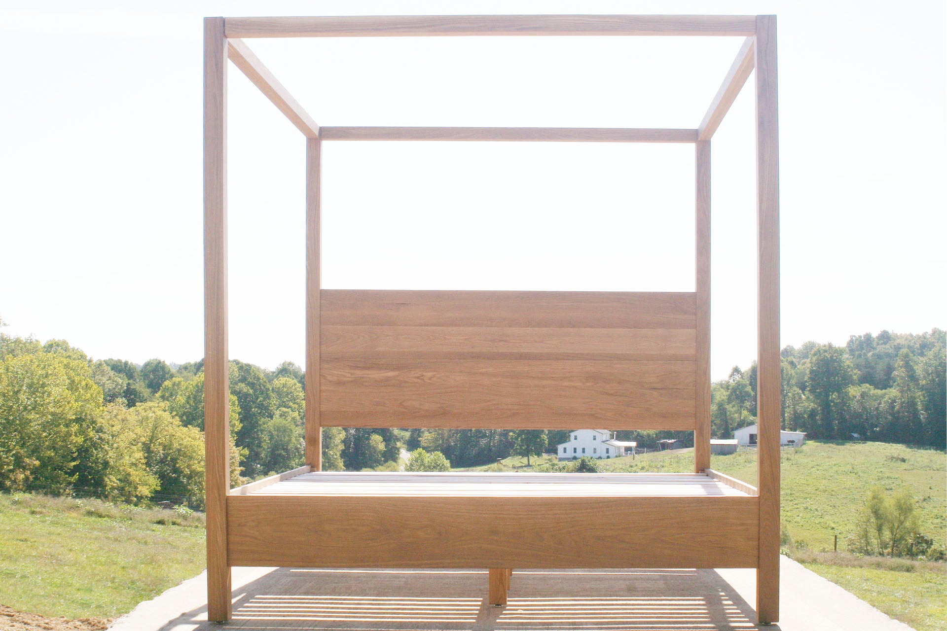 front view solid natural Canopy Bed with a square headboard