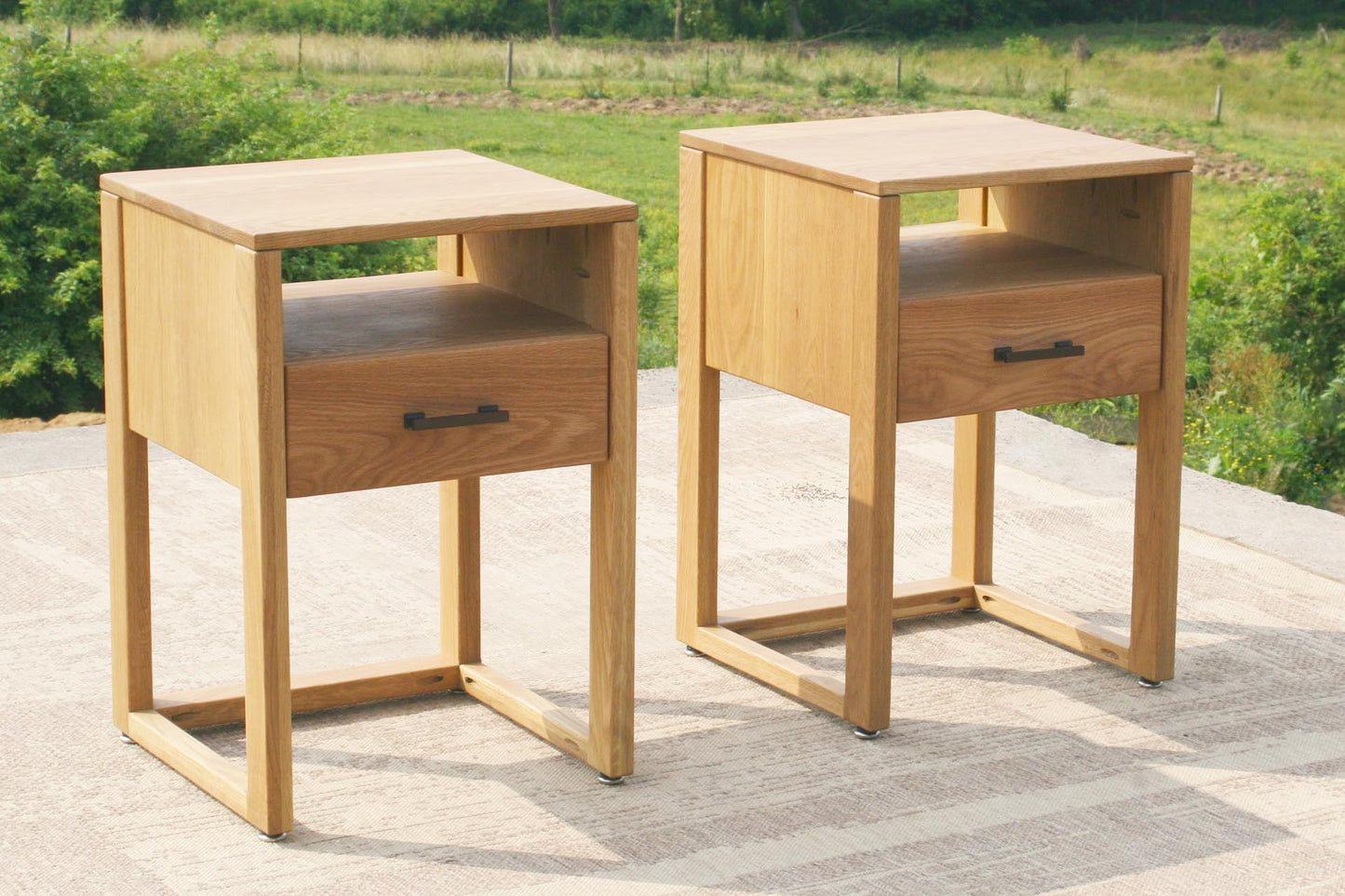 two bedside cabinets with pull drawers