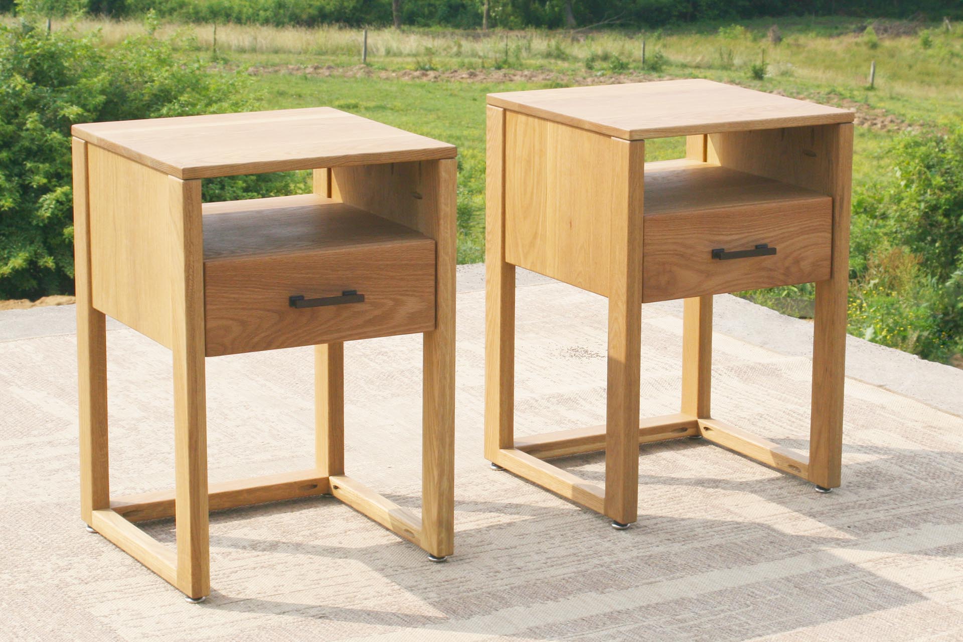 two bedside cabinets with pull drawers