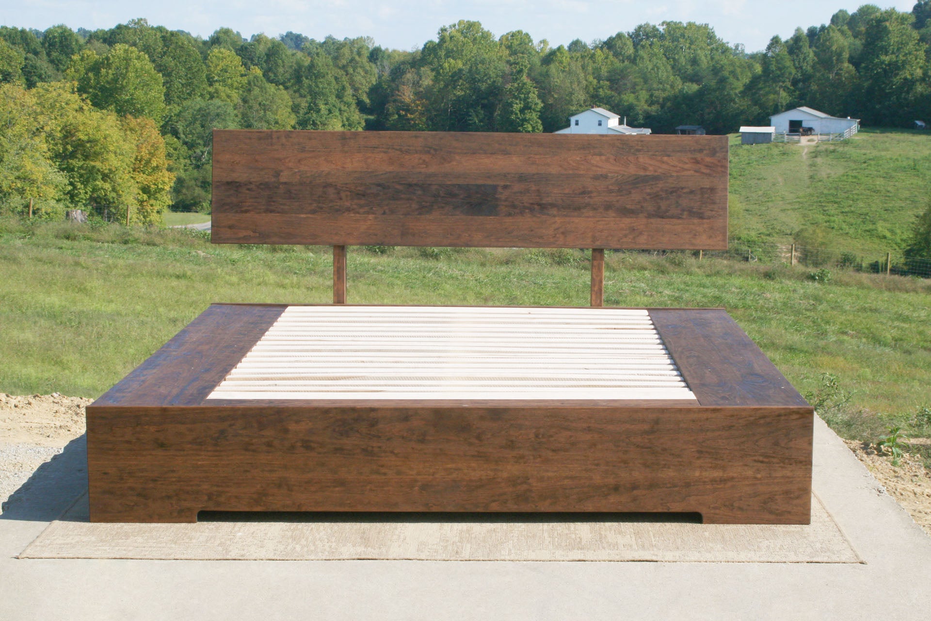 low platform bed with 6 drawers and angled headboard front view
