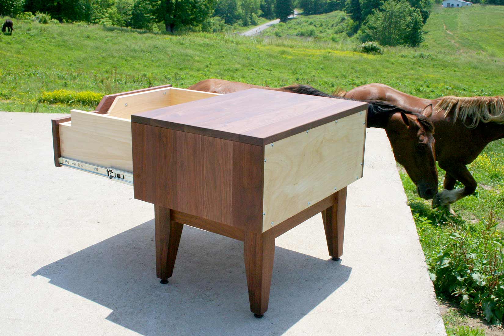 open drawer bedside table in walnut