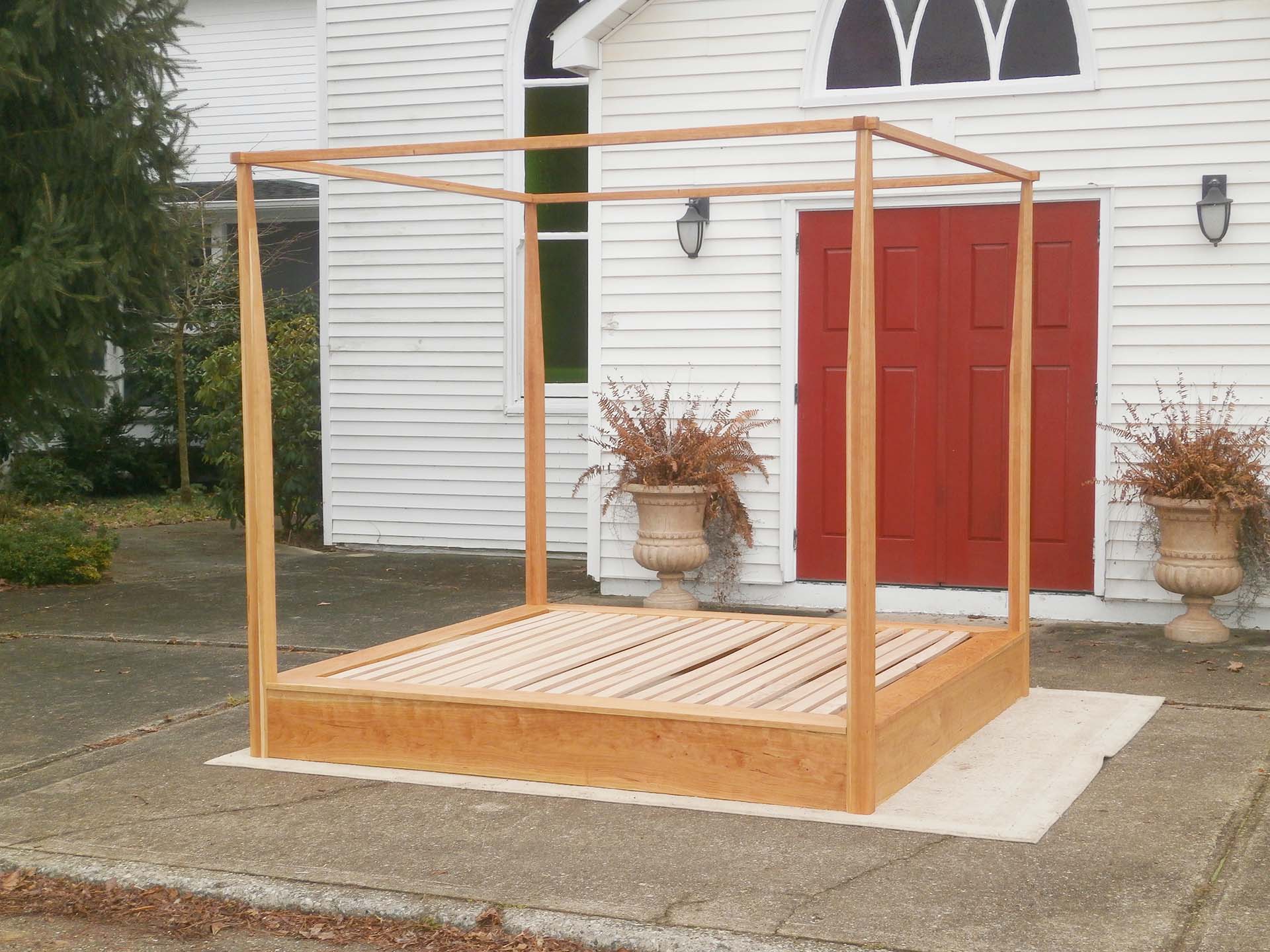 natural Platform Bed with a large rail canopy and tapered posts side view